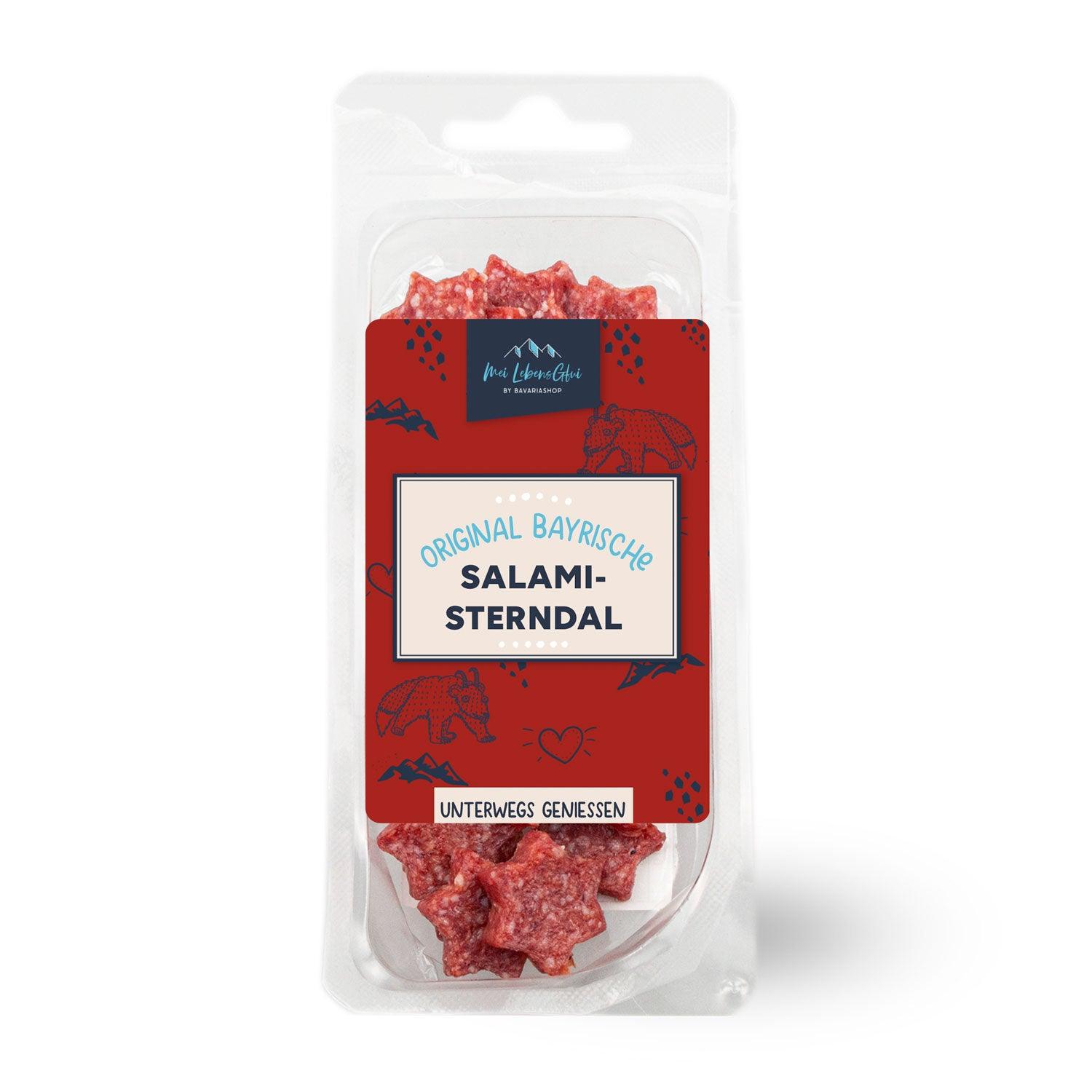 Fünf sternförmige Salami-Stücke in dunkler Farbgebung mit sichtbarer grober Struktur, angerichtet auf Holz.