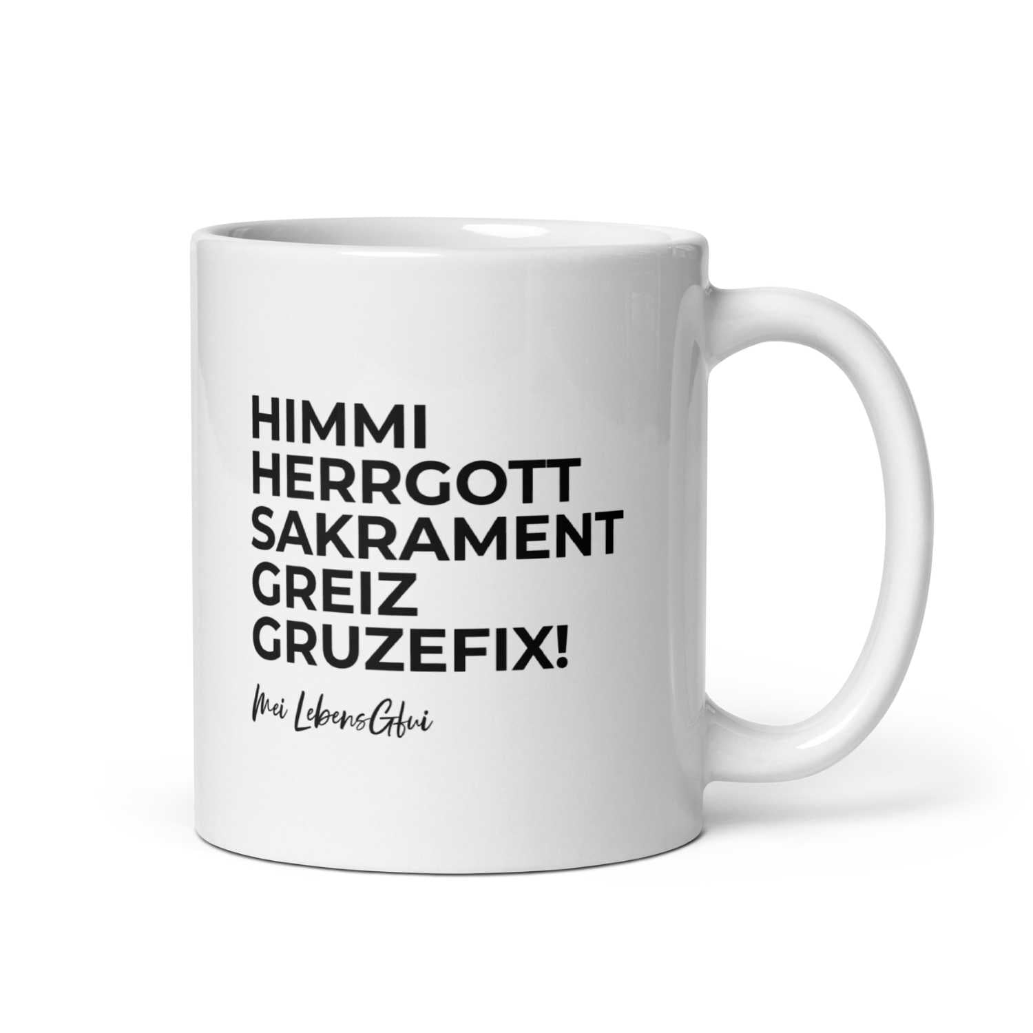 Porzellantasse mit „Die Schlümpfe“-Lizenzmotiv und dem bayerischen Schriftzug „Himme Herrgott“, 330 ml.