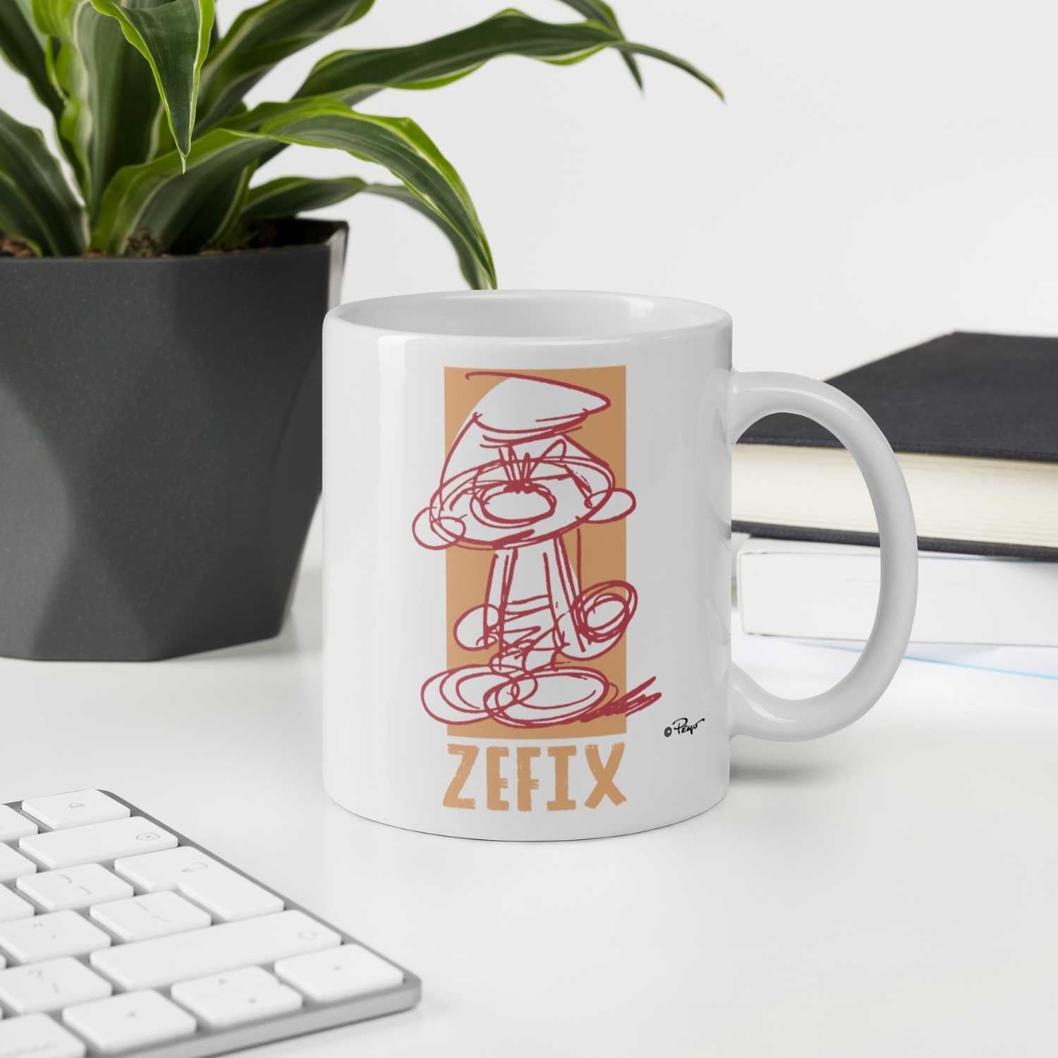 Porzellantasse mit Schlumpf-Motiv und großem „Zefix“-Schriftzug gegenüber dem Henkel, Fassungsvermögen 330 ml.