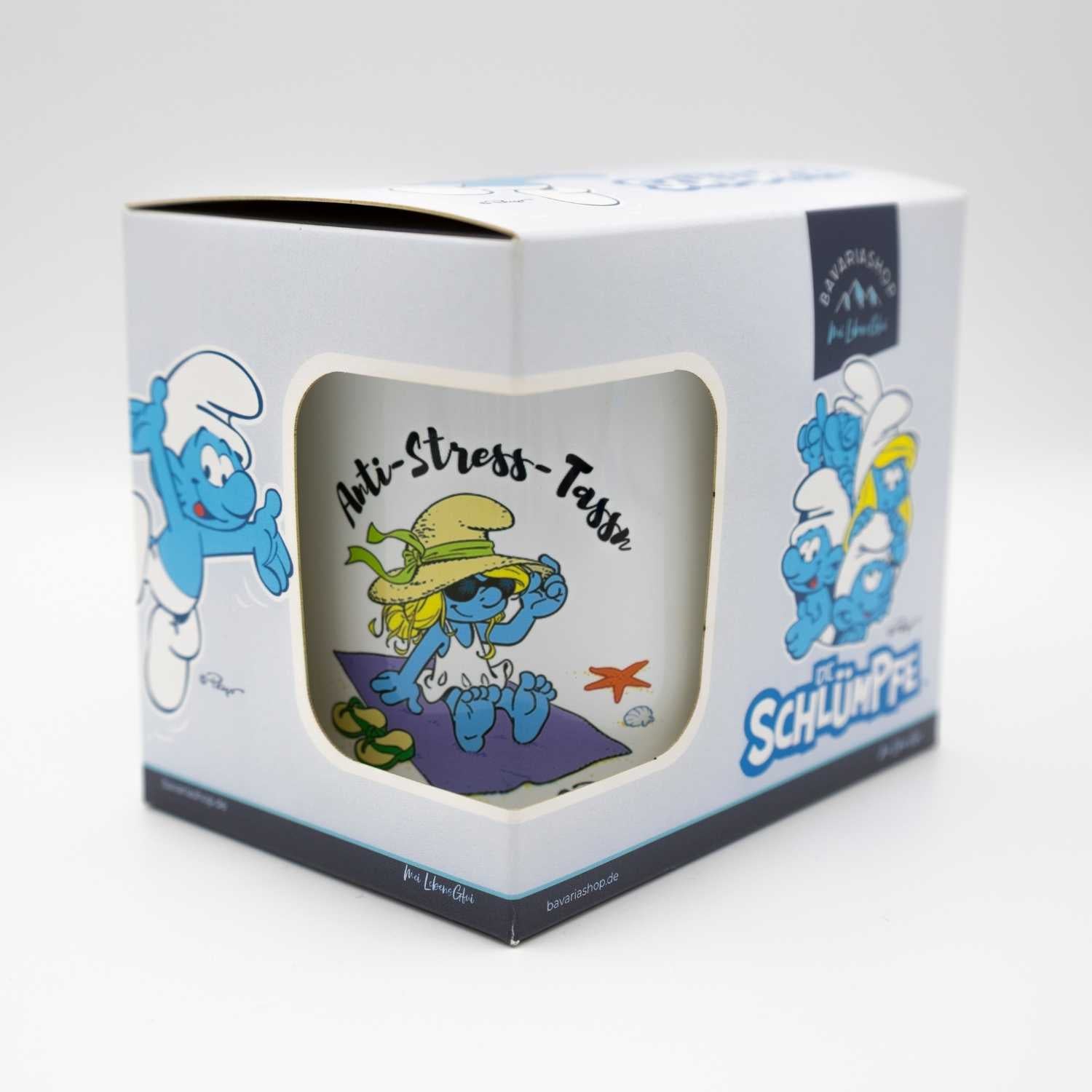 Emailletasse mit Schlumpf-Motiv und Schriftzug „Anti Stress Tass’n“, blauer Rand, rund, ca. 330 ml, Metall.