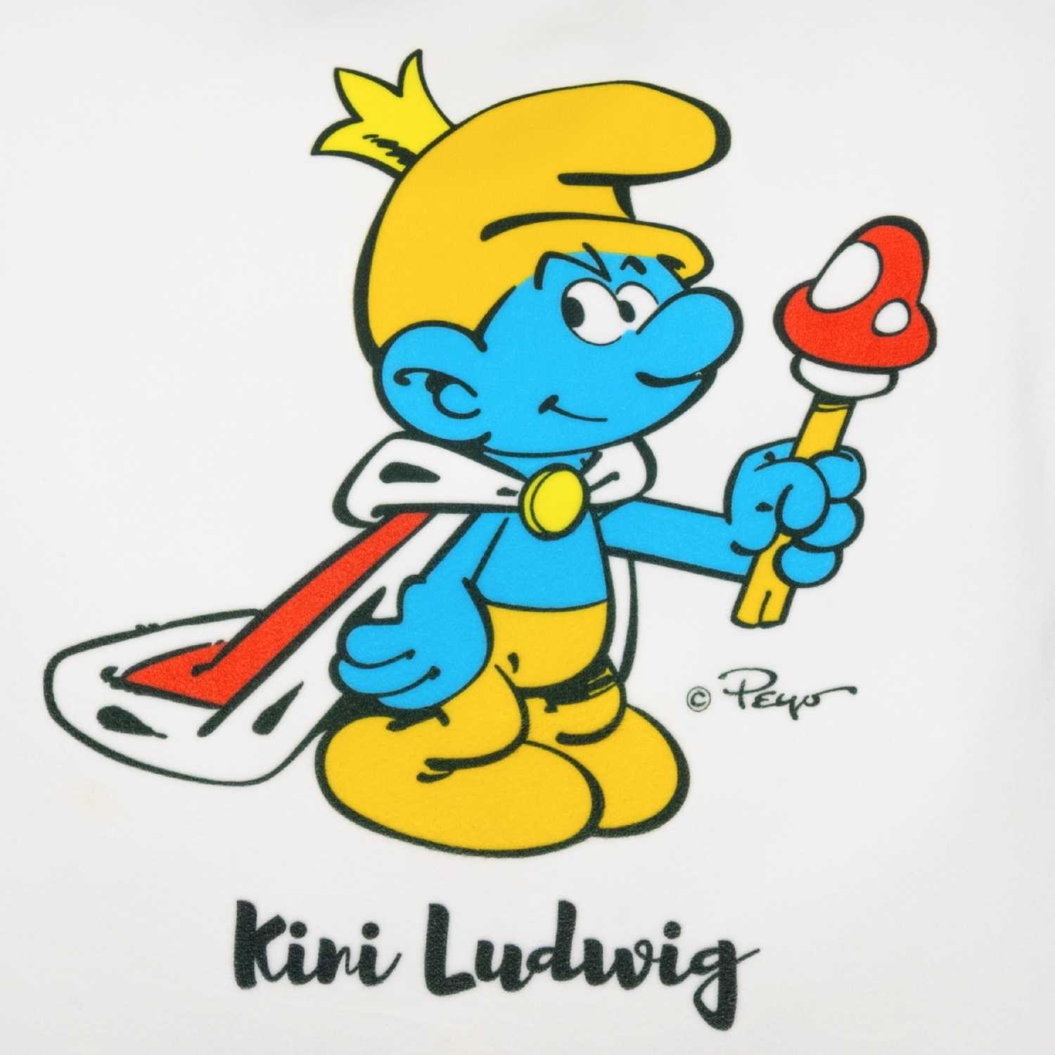Quadratisches Kuschelkissen mit Schlumpf-Motiv, personalisiertem Namensdruck und Spruch auf der Vorderseite.