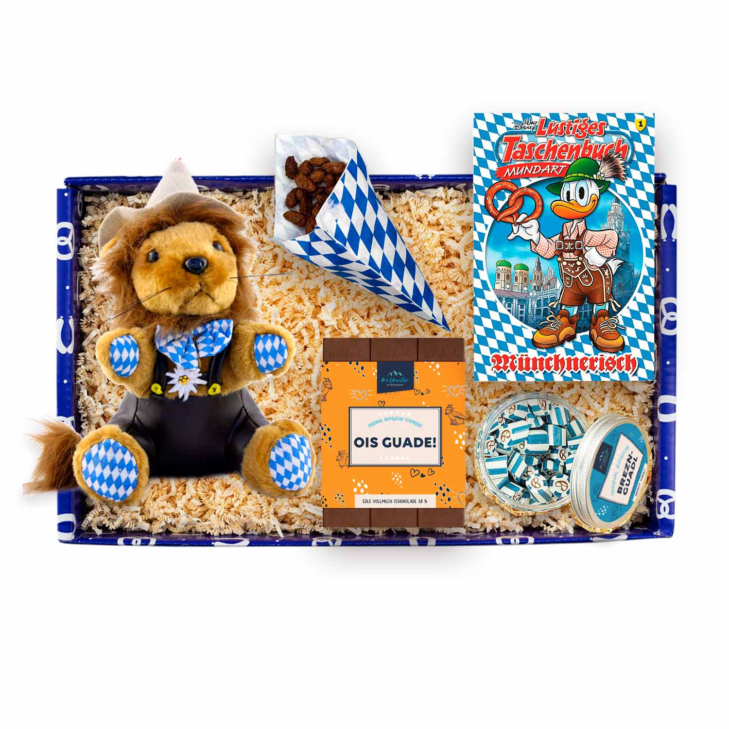 Geschenkbox mit Plüschlöwe in Tracht, Brezel-Bonbons und Schokolade; Farben: Beige, Braun, Weiß, Blau.