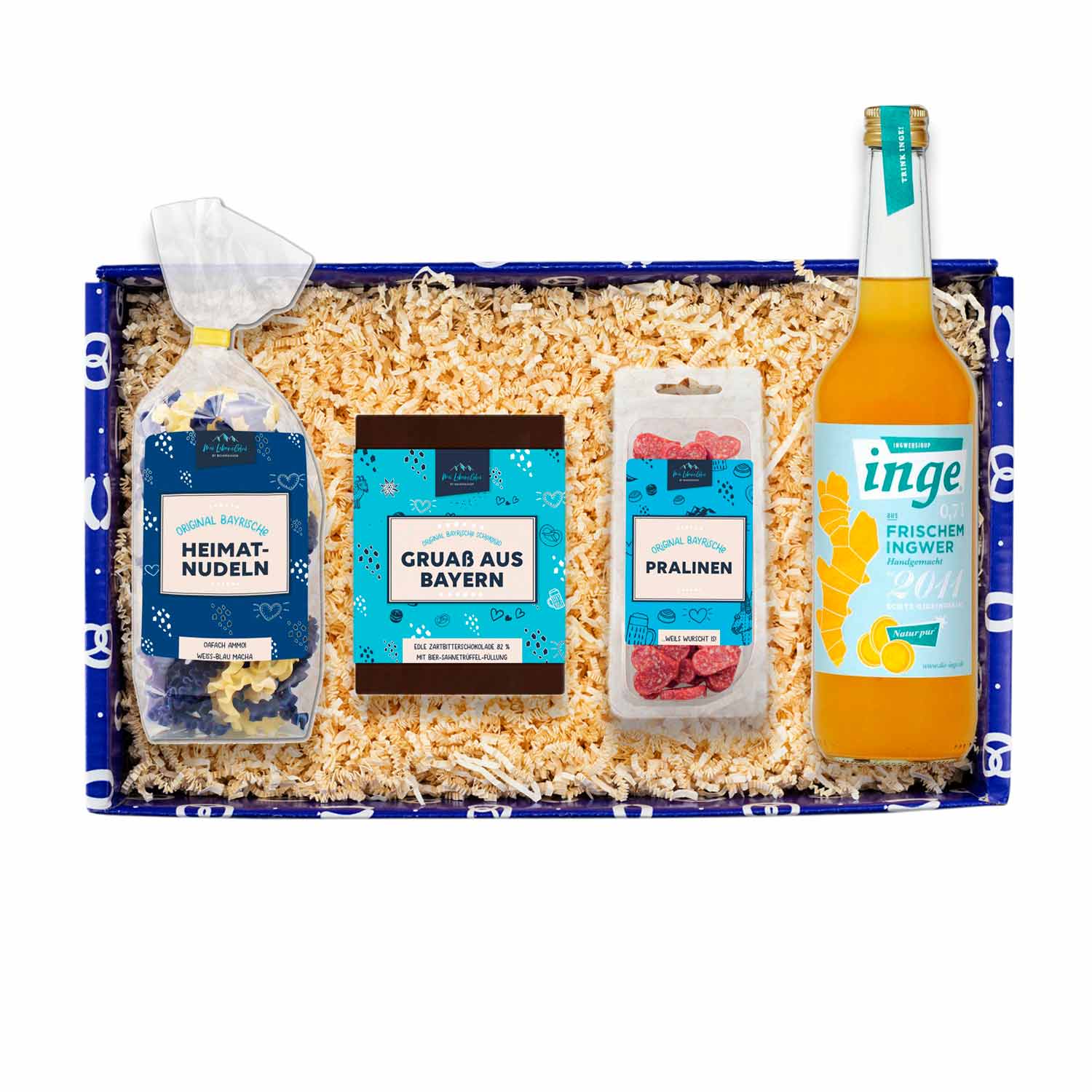 Geschenkbox mit Ingwersirup in Glasflasche, Heimatnudeln, Kräutersalz, Schokolade und bayerischen Spezialitäten.