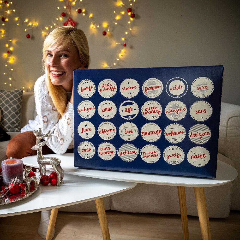Adventskalender mit 23 regionalen bayerischen Bieren und einem Bierglas, in dekorativer Box im Bayern-Design.