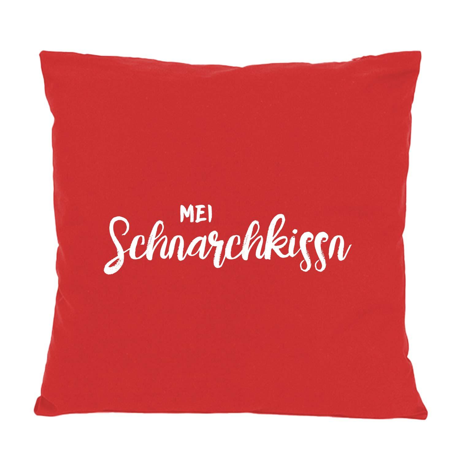 Rotes Kissen "Mei Schnarchkissn" mit weißem Schriftzug, Dekokissen für gemütliche Schlafzimmeratmosphäre.