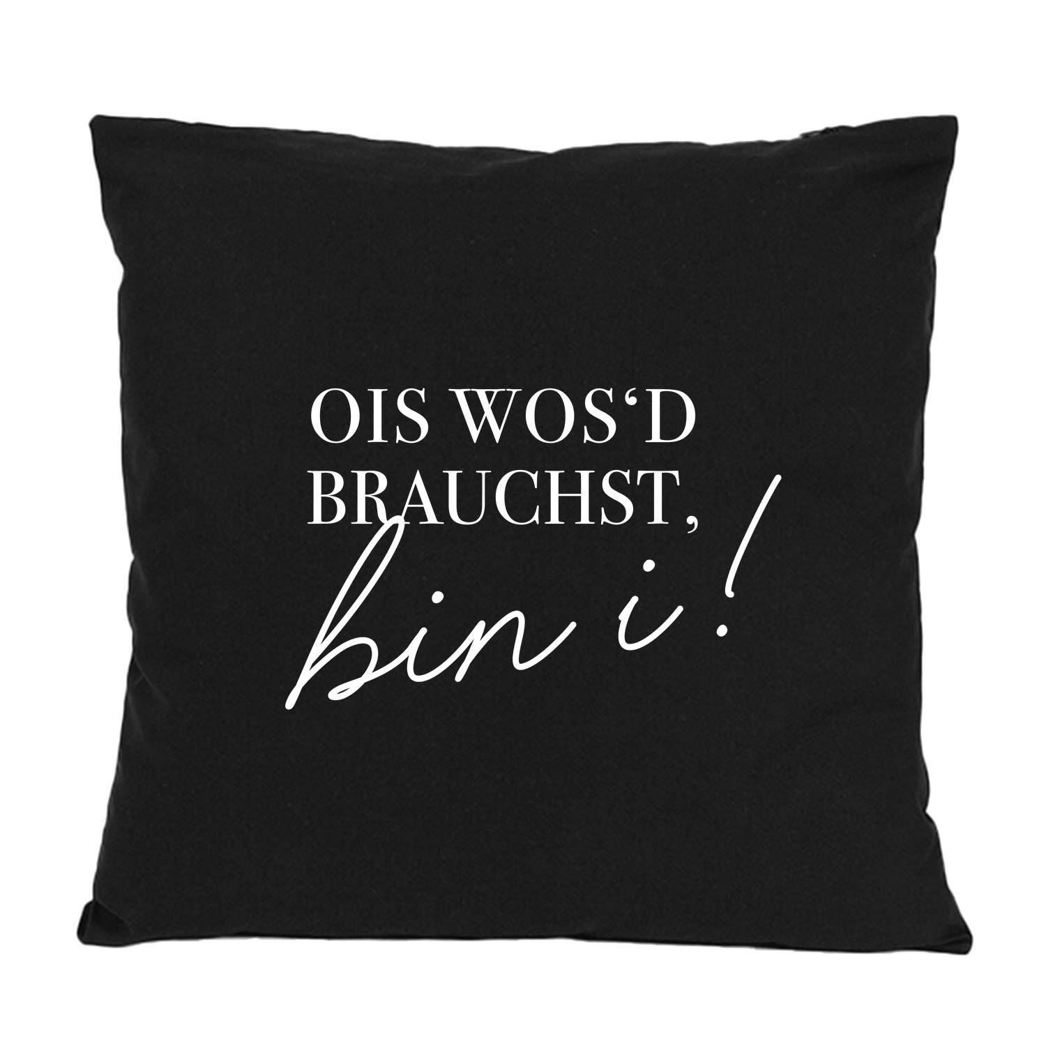 Dekoratives Kissen "Ois wos'd brauchst..." schwarz mit weißem bayerischen Spruch als Blickfang im Wohnzimmer.
