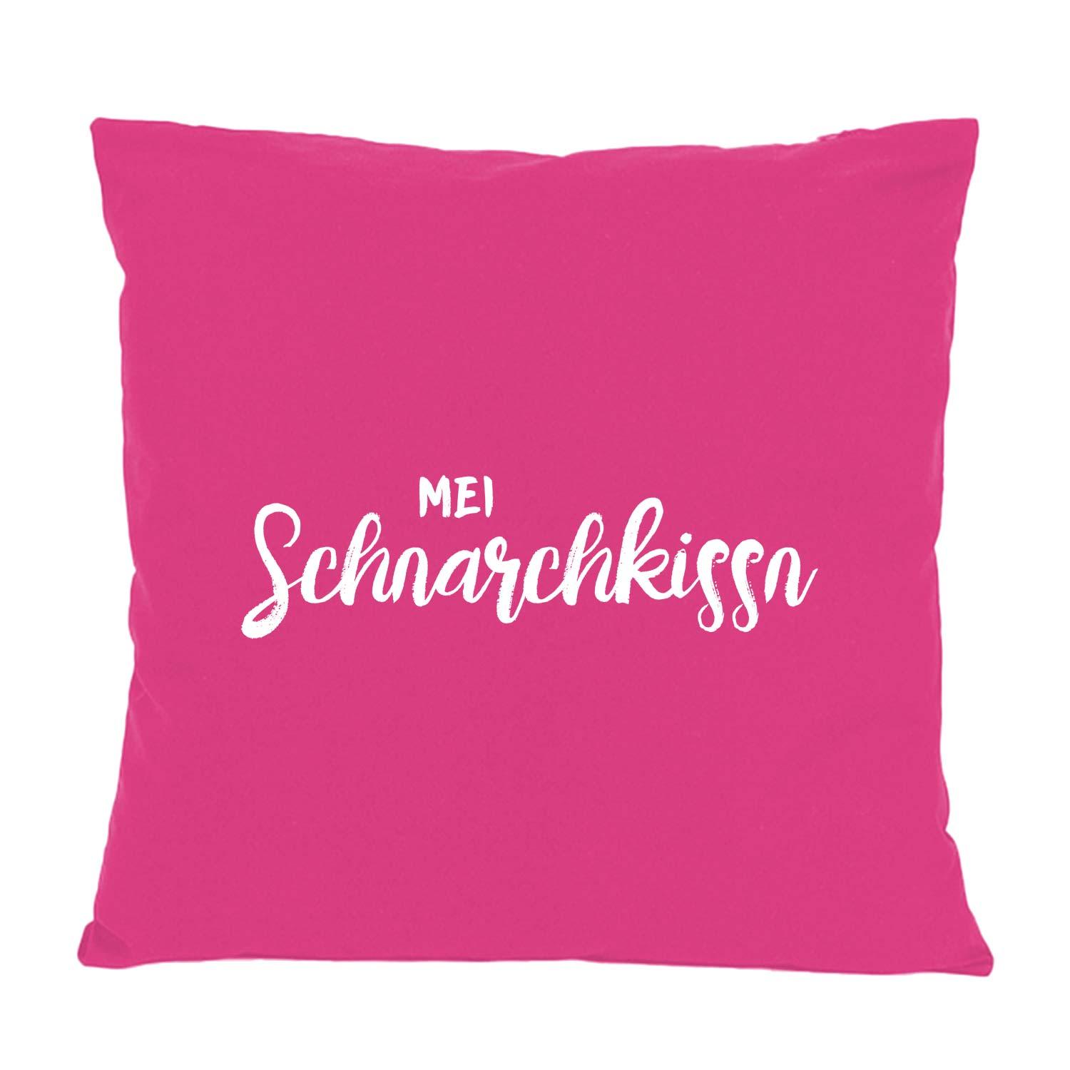 Fuchsiafarbenes Kissen Mei Schnarchkissn mit weißem, handschriftlichem Aufdruck als dekoratives Geschenk.