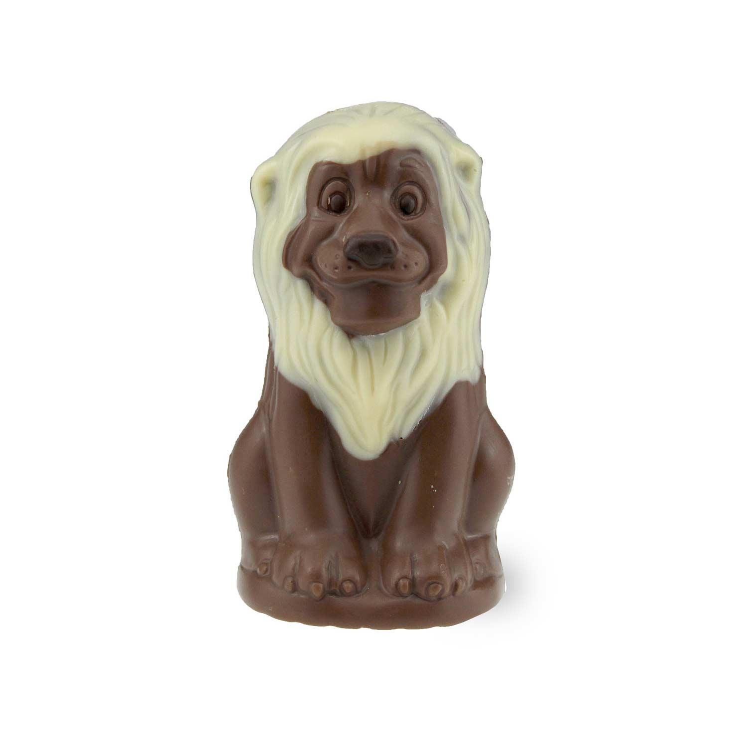 Schokoladenfigur in Löwenform aus Vollmilchschokolade mit Details aus weißer und Zartbitterschokolade, ca. 10 × 5,5 cm.