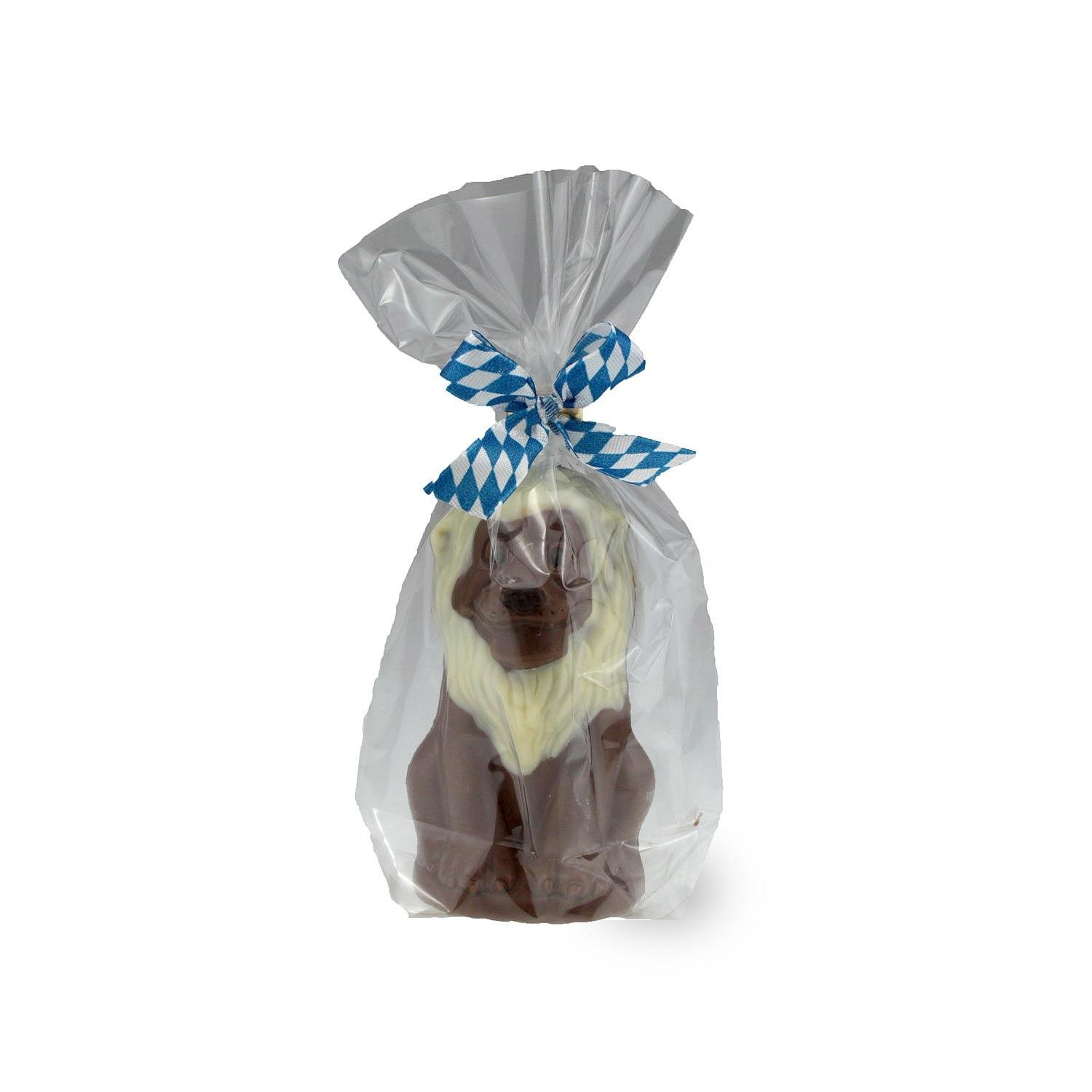 Vollmilchschokoladenfigur in Löwenform, verziert mit weißer und Zartbitterschokolade, ca. 10 × 5,5 cm, 70 g.