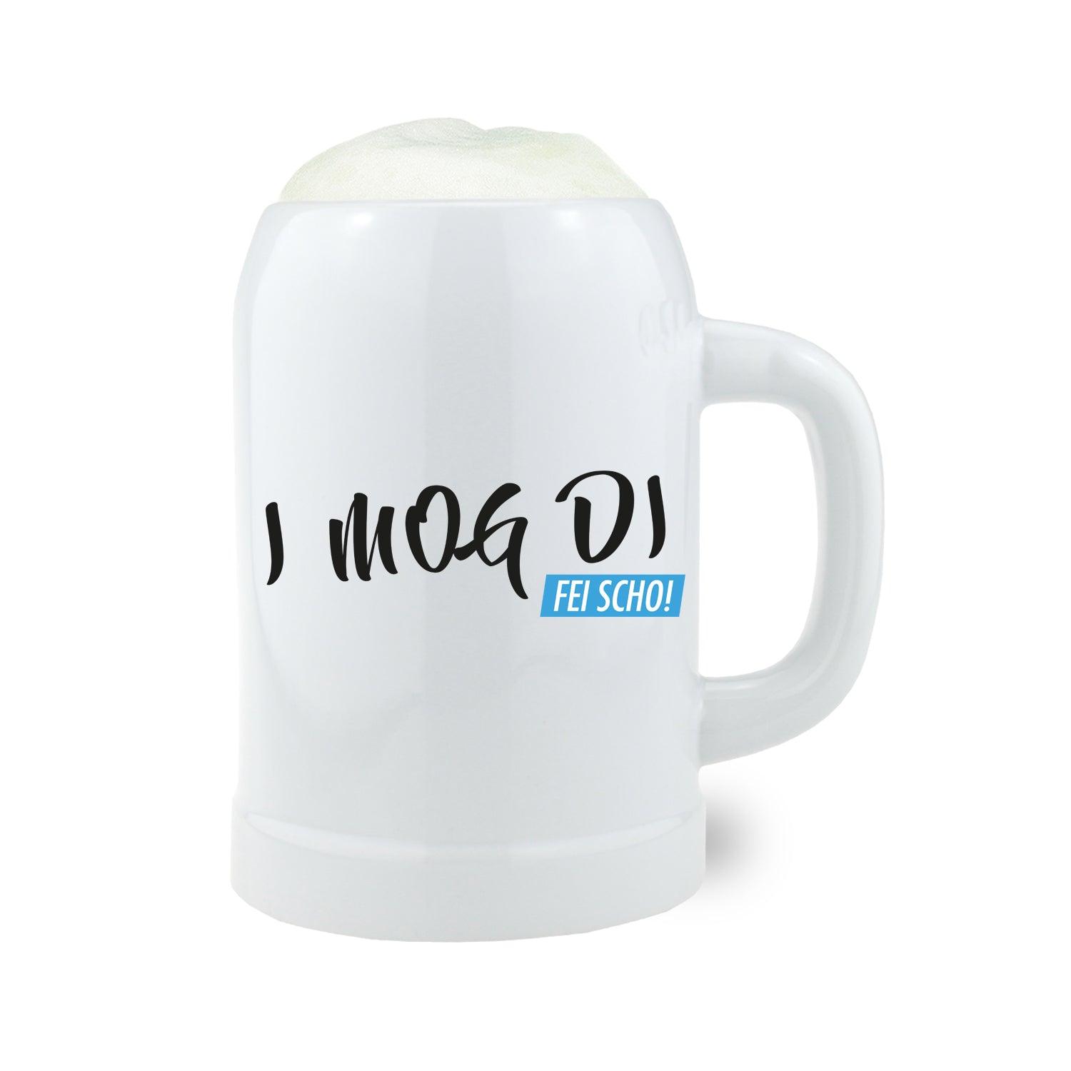 Steinkrug mit bauchiger Form, Henkel und blauem Schriftzug „I mog di fei scho“ auf unbehandelter Oberfläche, 0,5 l