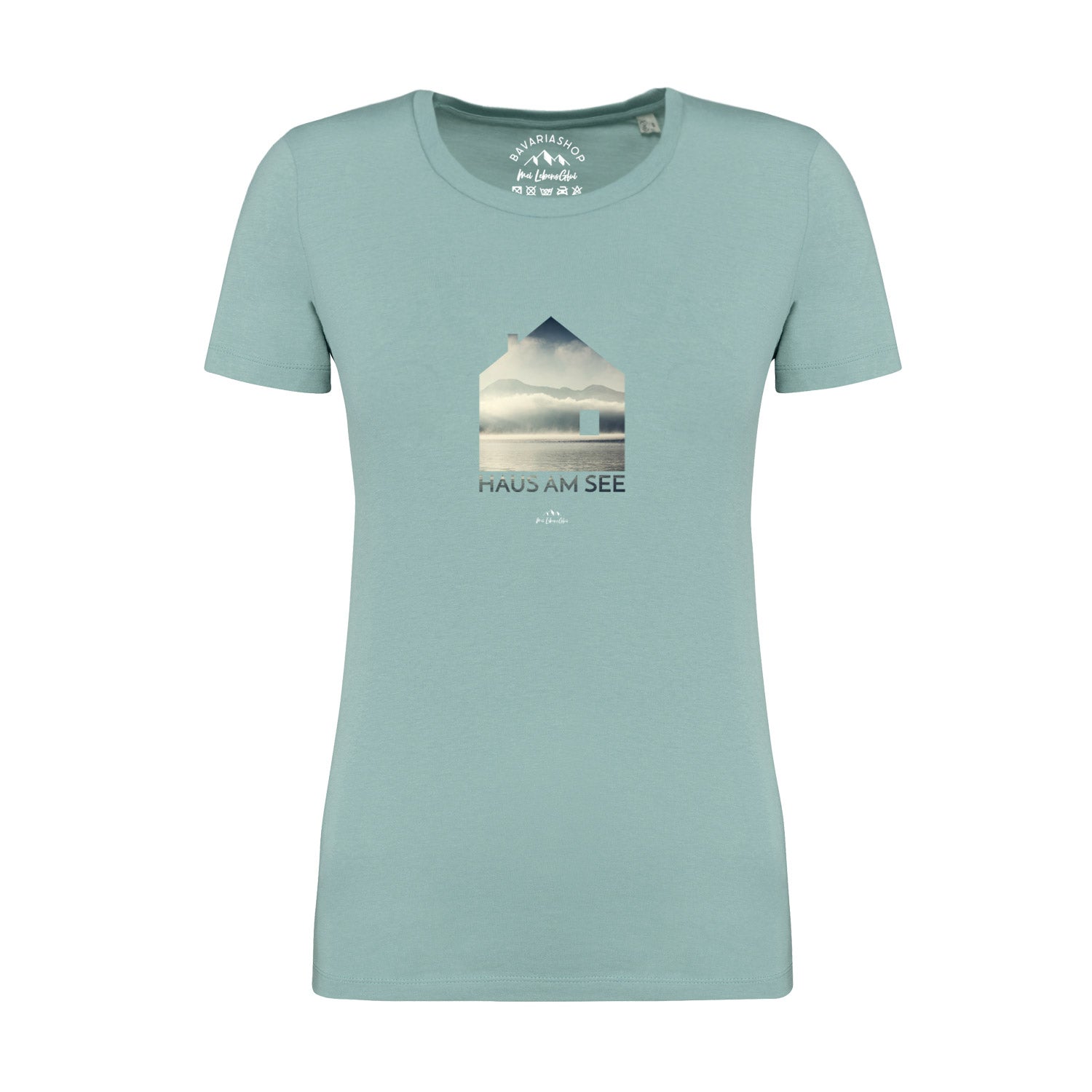 Pastellgrünes Damen-T-Shirt mit Frontprint „Haus am See“, Rundhalsausschnitt, 100 % Bio-Baumwolle, kurzarm.