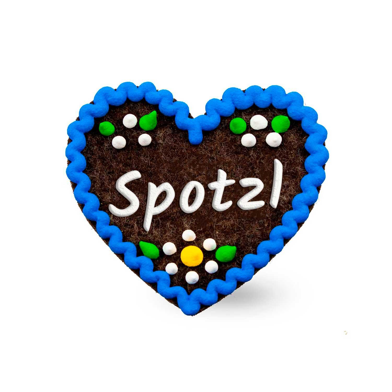 Herzförmiger Filz-Anstecker mit Schriftzug „Spotzl“, gesticktem Rand, Sicherheitsverschluss, ca. 6,5 x 7 cm.