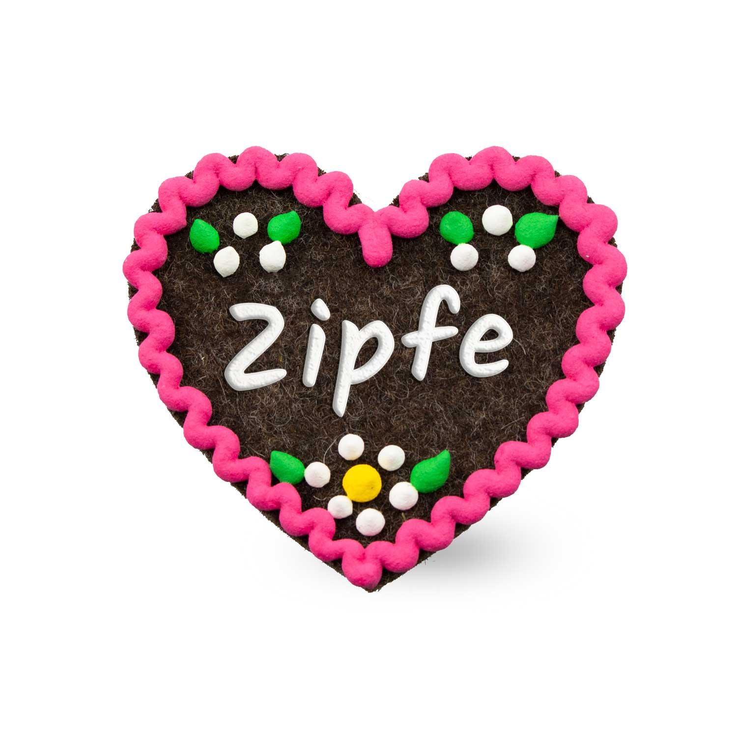 Herzförmiger Filz-Anstecker mit gesticktem Schriftzug „Zipfe“ und Sicherheitsverschluss auf der Rückseite, ca. 6,5 x 7 cm.