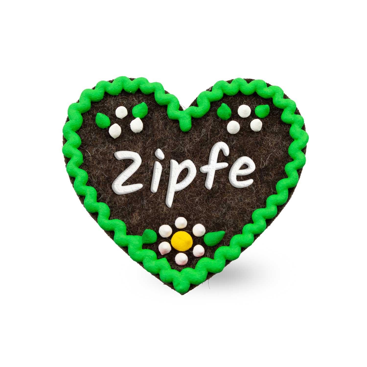 Filzherz-Anstecker in Herzform mit Schriftzug „Zipfe“, aus Filz mit Sicherheitsnadelrückseite, ca. 6,5 x 7 cm.