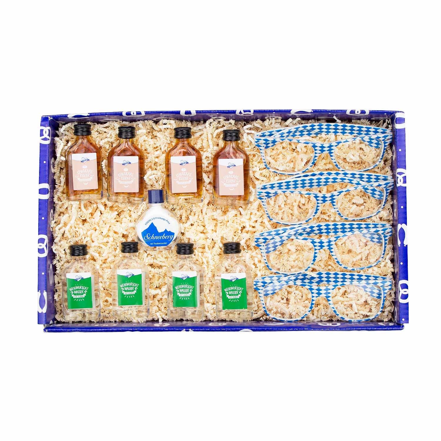 Bayerische Geschenkbox mit vier weiß-blauen Brillen, vier „Weißwurschtwasser“-Schnäpsen und Schnupftabak.