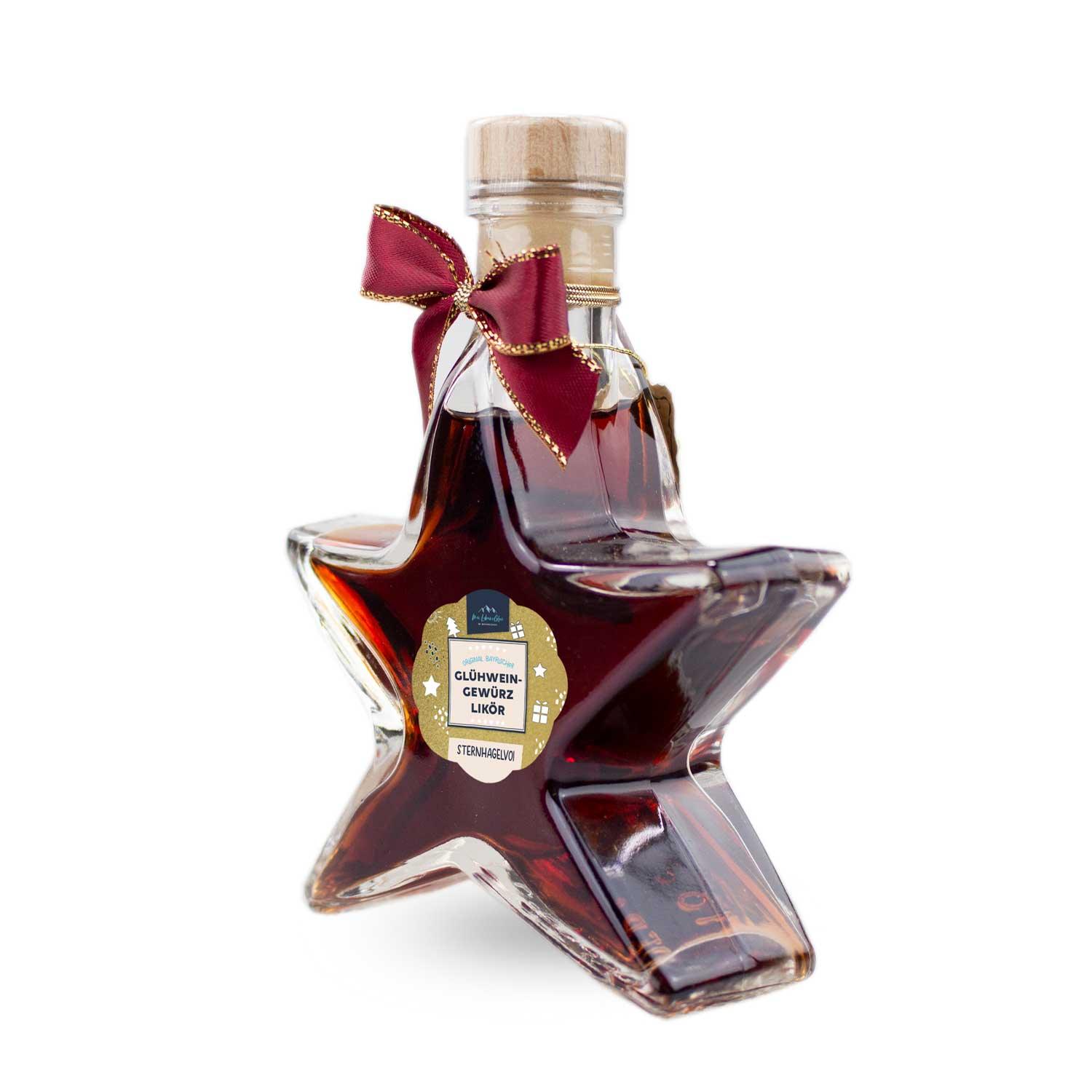 Glühweingewürz-Likör in sternförmiger Glasflasche mit rotem Inhalt und weißem Schriftzug, 100 ml.
