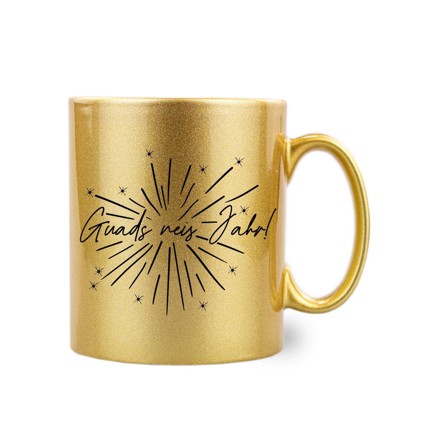 Gold-glitzernde Keramiktasse mit schwarzem Henkel und weißem Aufdruck "Guads neis Jahr!", 300 ml Fassungsvermögen.