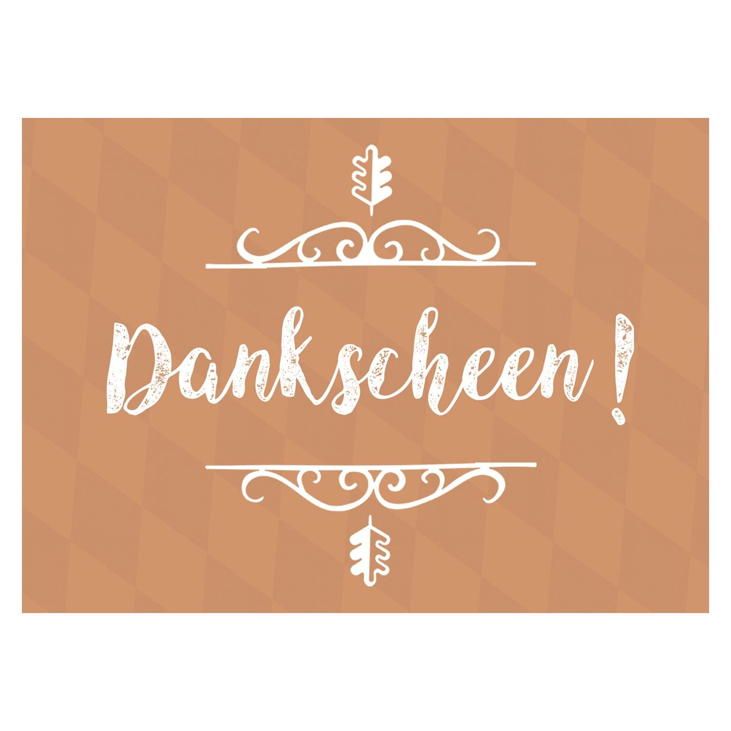 Grußkarte im Querformat mit dem bayerischen Schriftzug „Dankscheen!“ auf strukturiertem, hellem Hintergrund. Maße: 14,8 x 10,5 cm.
