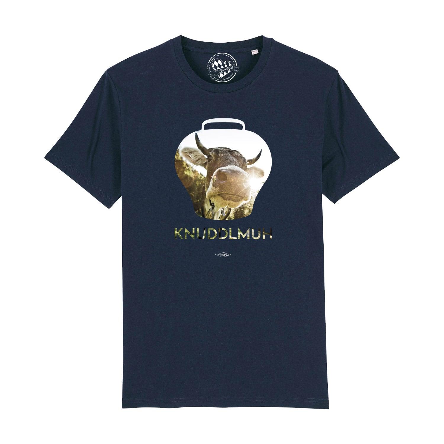 Herren T-Shirt in Schwarz mit weißem Kuh-Motiv und bayerischem Schriftzug „Knuddlmuh“, aus Bio-Baumwolle.