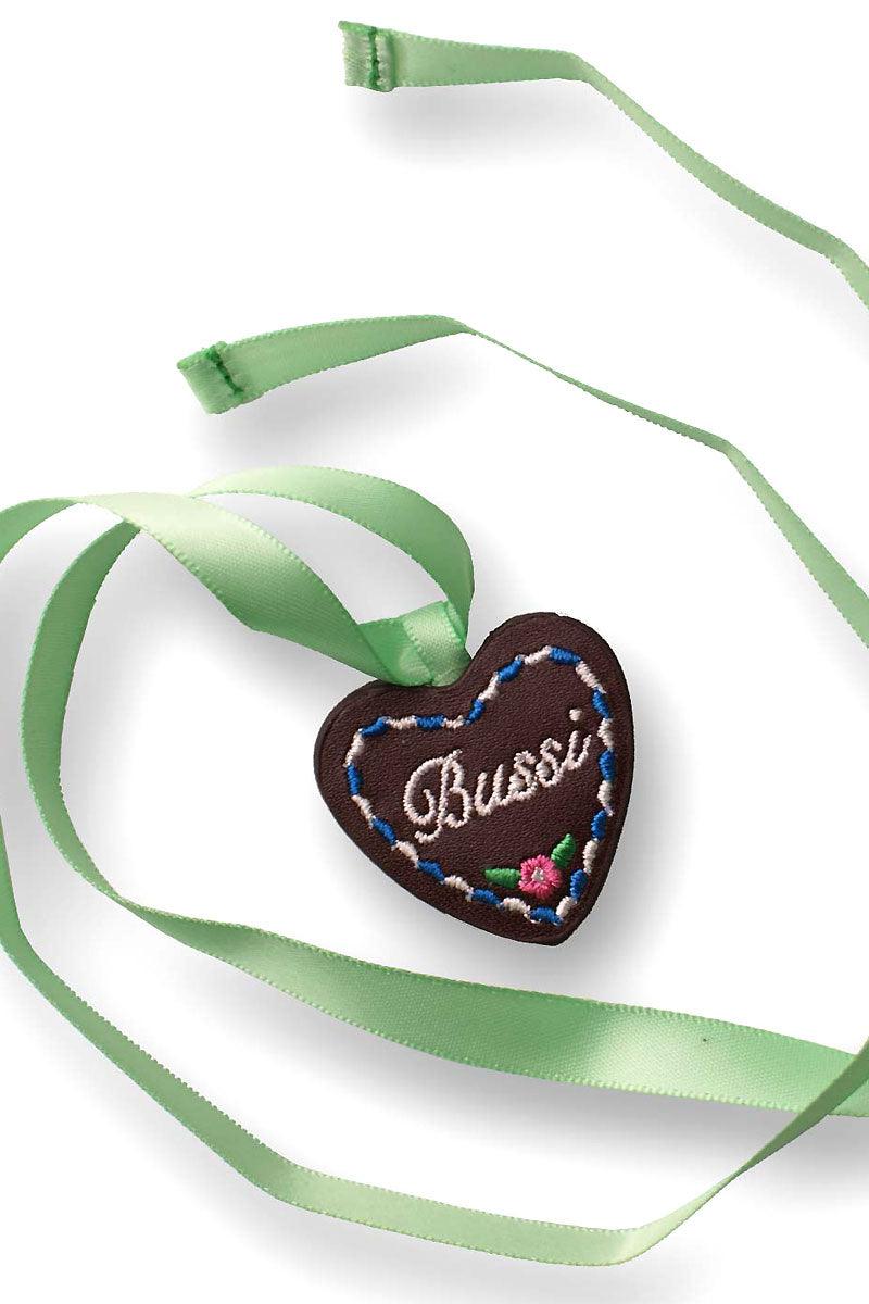 Braune Filzkette mit herzförmigem Anhänger, pinkem Stickschriftzug „Bussi“ und Hofbräuhaus-Krone.