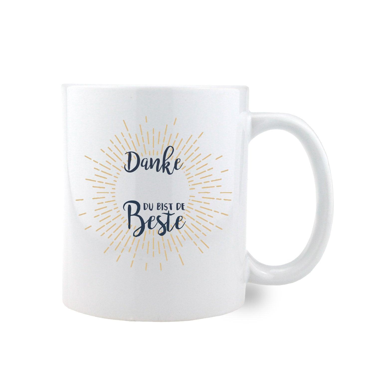 Weiße Keramiktasse mit schwarzem Henkel und Rand, rosa Herz, Aufschrift „Danke, bist de Beste“ und personalisierbarem Namen; ca. 330 ml.