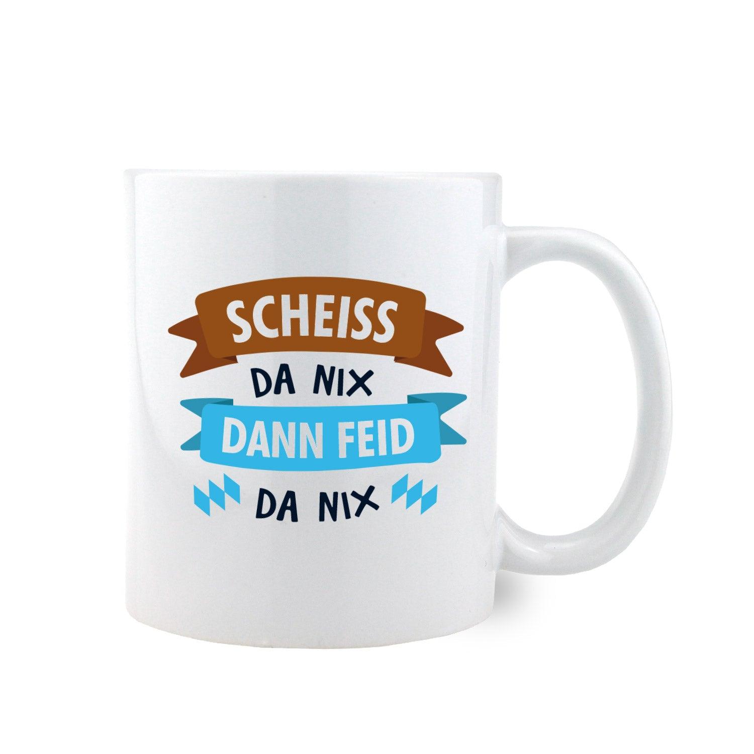 Weiße Keramiktasse mit schwarzem Henkel und schwarzer Innenseite, Aufdruck „Scheiß da nix, dann feid da nix“, ca. 330 ml.