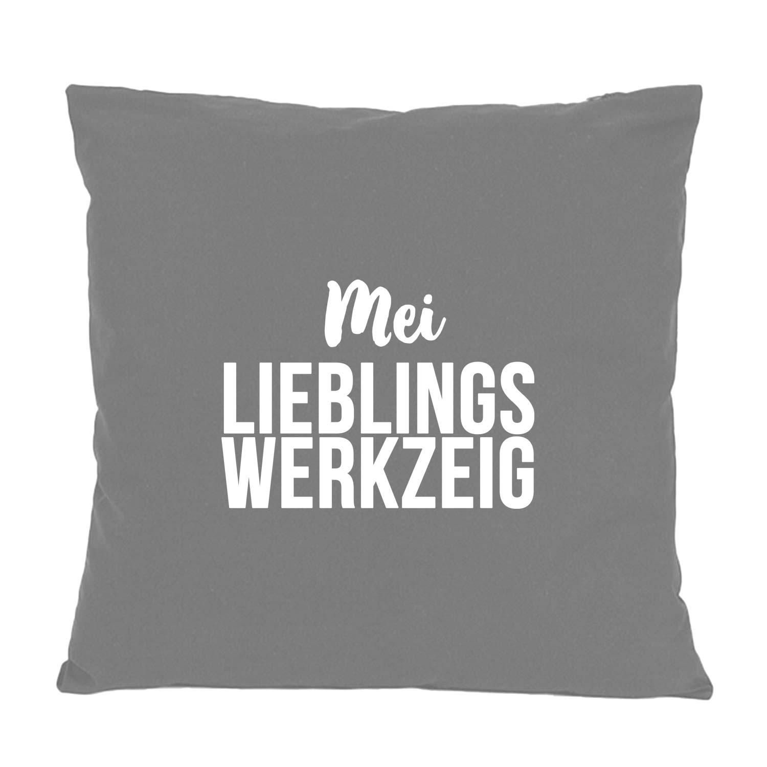 Quadratisches Dekokissen mit aufgedrucktem bayerischem Schriftzug „Mei Lieblingswerkzeig“, aus Baumwolle, 40×40 cm.