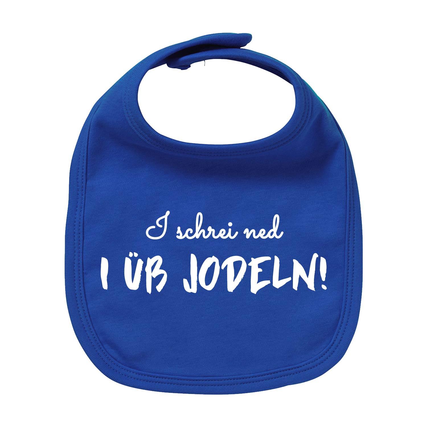 Weißes Baby-Lätzchen mit blauem Schriftzug „I üb jodeln“, aufgedrucktem Edelweiß, aus Bio-Baumwolle.