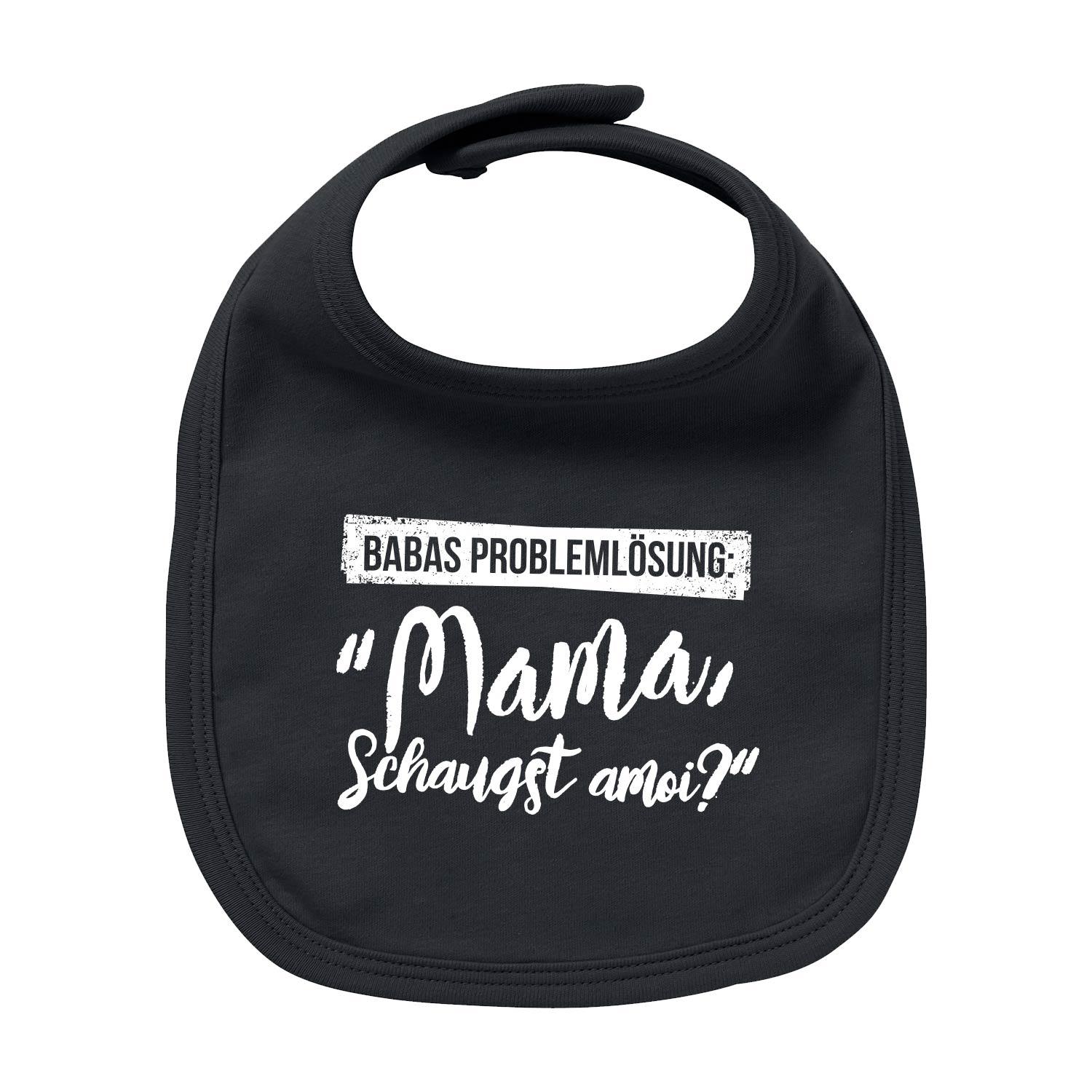 Weißes Baby-Lätzchen mit blauem Schriftzug „Papas Problemlösung: I bin’s", aus Bio-Baumwolle, rechteckige Form.