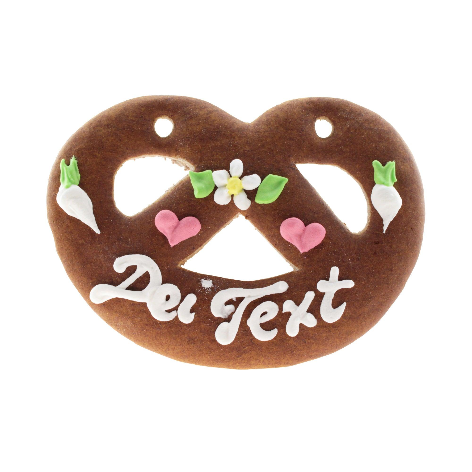 Lebkuchenherz in Brezenform mit weiß-rotem Zuckerdekor und individuellem Schriftzug, ca. 12 × 15 cm, 90 g.