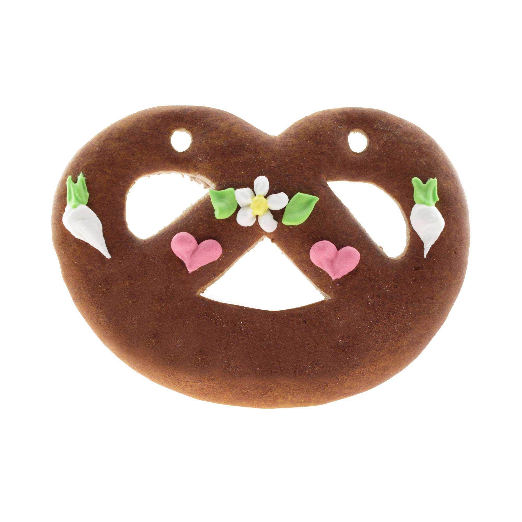 Lebkuchen in Brezenform mit rot-weiß umrandetem Herz, handbeschriftet mit individuellem Wunschtext, ca. 12×15 cm.