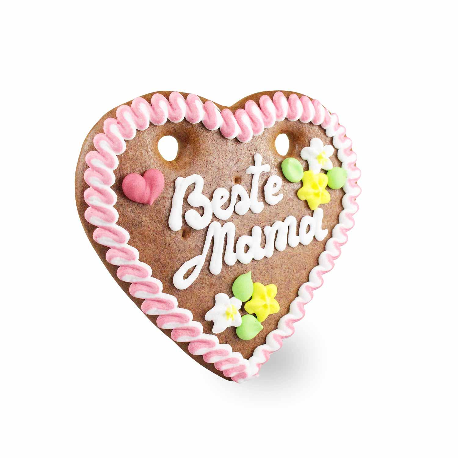 Herzförmiges Lebkuchenherz mit weiß-blauer Randverzierung und rosa Schriftzug „Beste Mama“, handgefertigt aus braunem Lebkuchen, ca. 14 x 17 cm, 100 g.