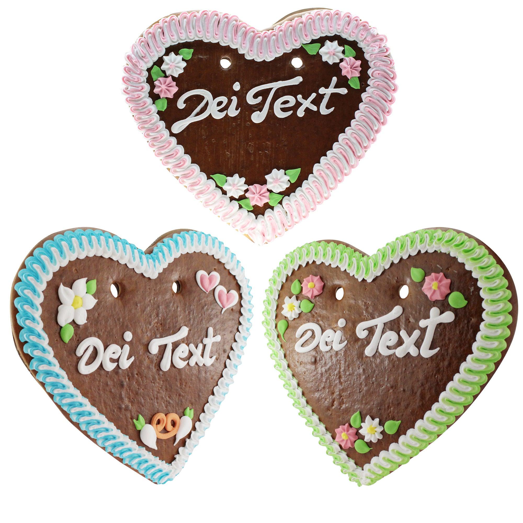 Braun-weiß verziertes Lebkuchenherz mit rotem Rand, Zuckerguss-Schrift und Blumenmotiv, ca. 36 × 34 cm, 500 g.