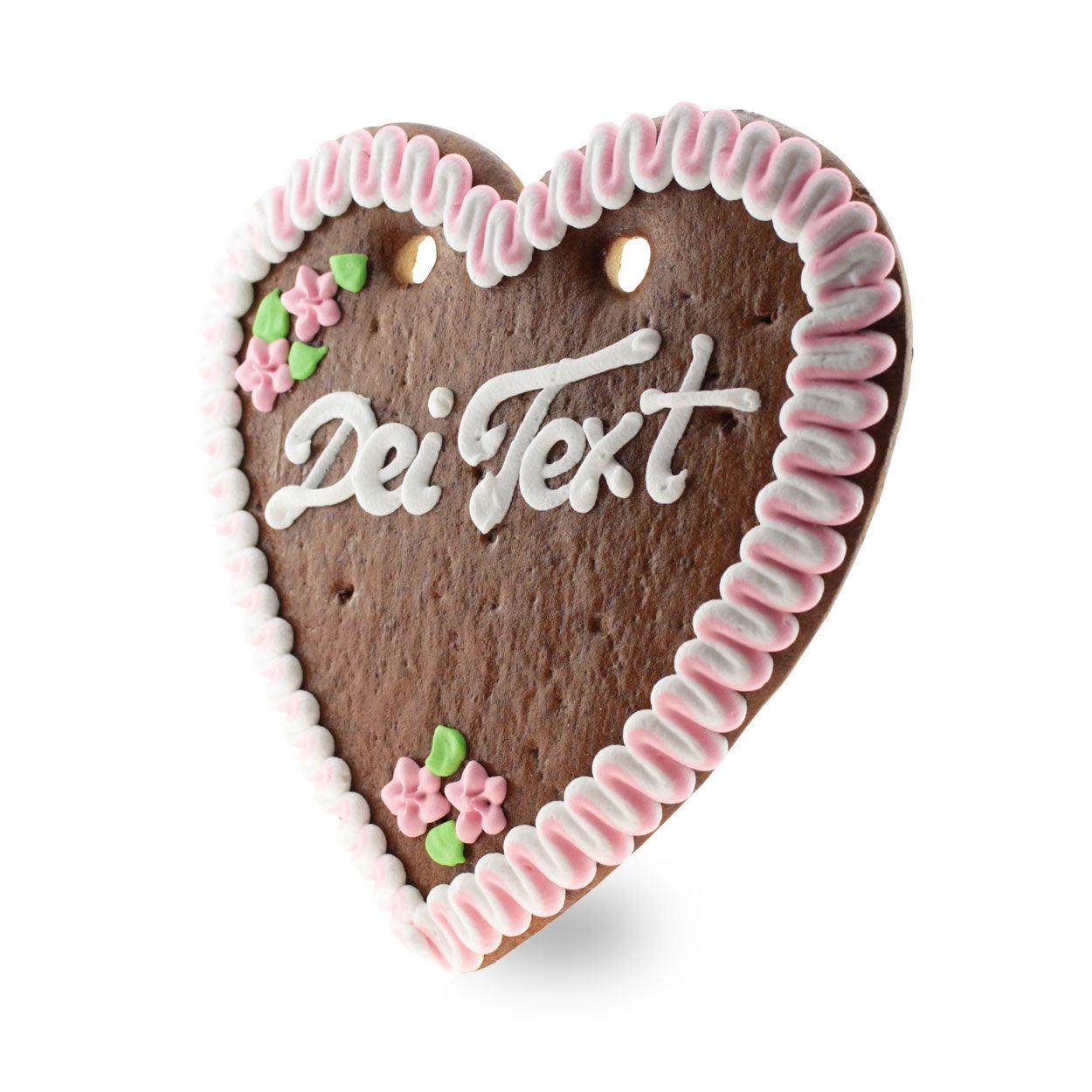 Herzförmiges Lebkuchenherz mit weiß-blauer Zuckerdekoration und individuellem Wunschtext; ca. 22 x 23 cm, 180 g.