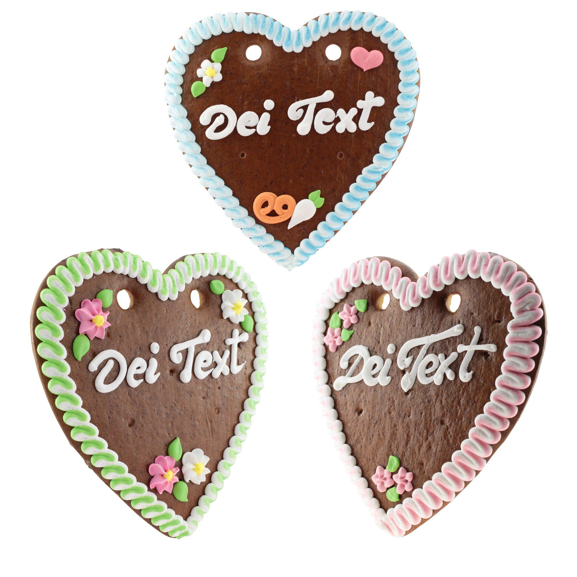 Braunes Lebkuchenherz mit weiß-blauer Zuckerdekoration, rotem Rand und Wunschtext in weißer Zuckerschrift, ca. 22x23 cm.