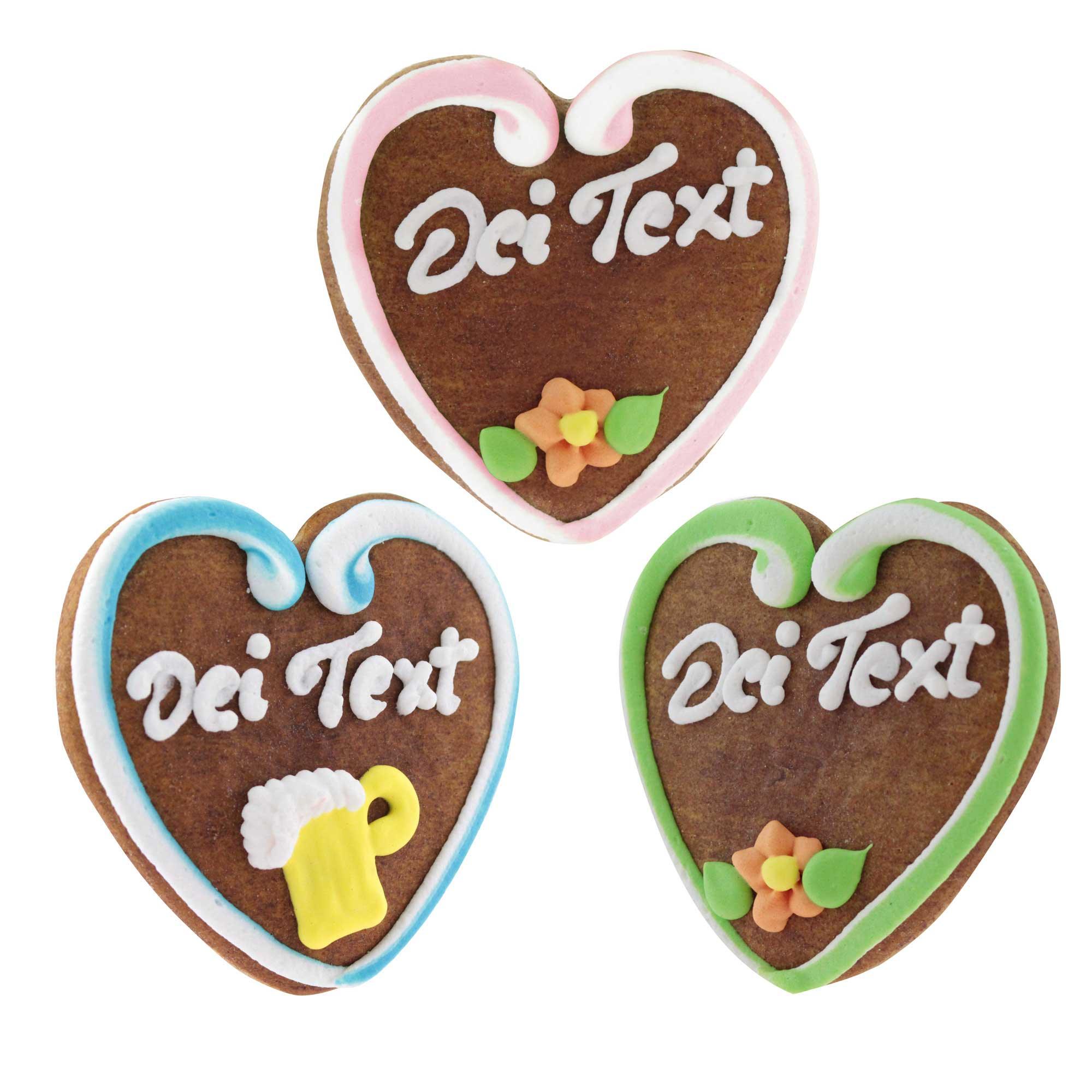 Herzförmiges Lebkuchenherz mit rosafarbenem Rand, weißer Zuckerschrift und individuell wählbarem Text, ca. 10 x 10 cm.
