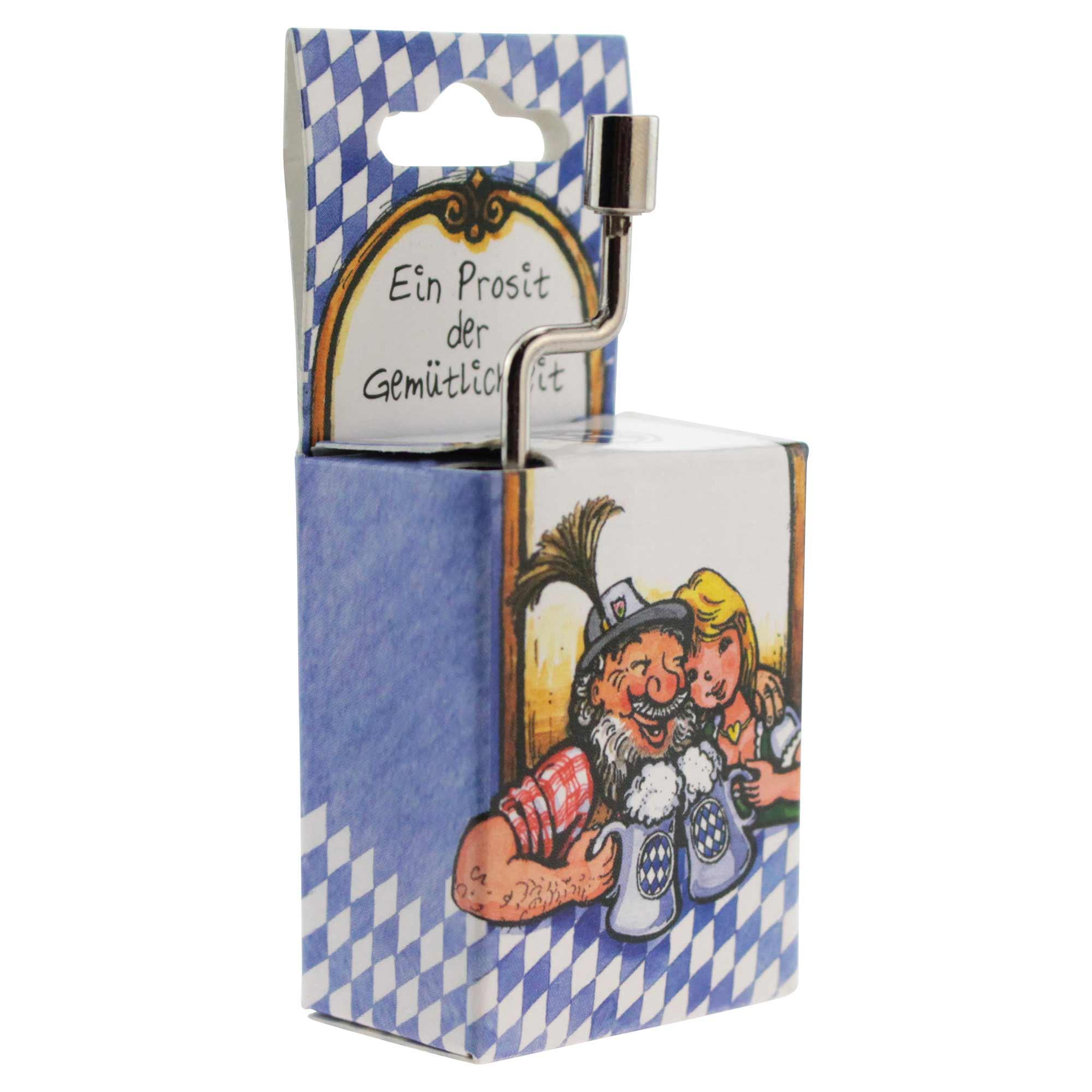 Mini-Drehorgel in Holzoptik mit Kurbel und Schriftzug „Ein Prosit der Gemütlichkeit“ auf gelber Frontseite.