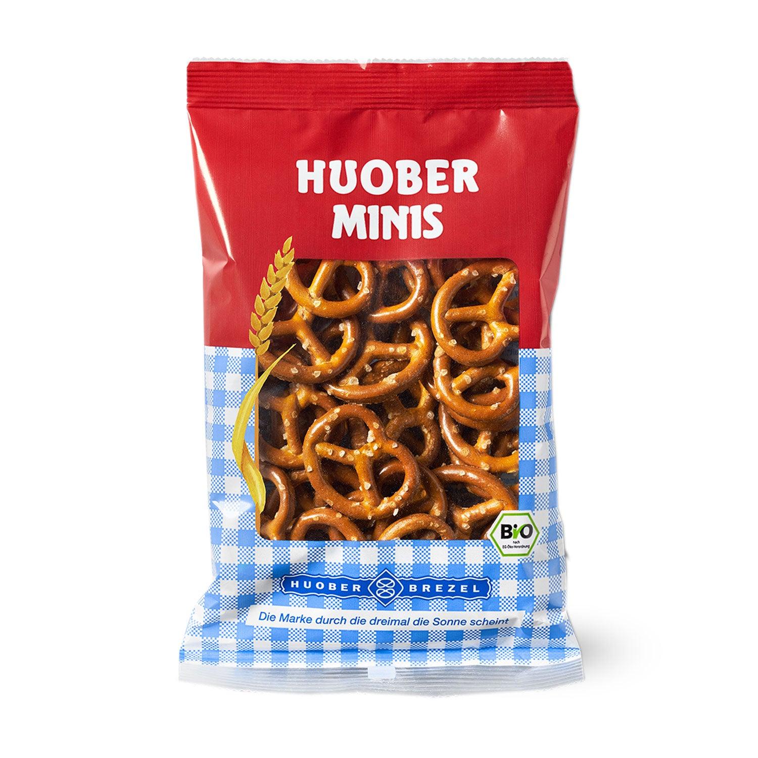Mini-Salzbrezn in klassischer Brezelform mit goldbrauner Kruste und grobem Salz bestreut, mehrfach enthalten.