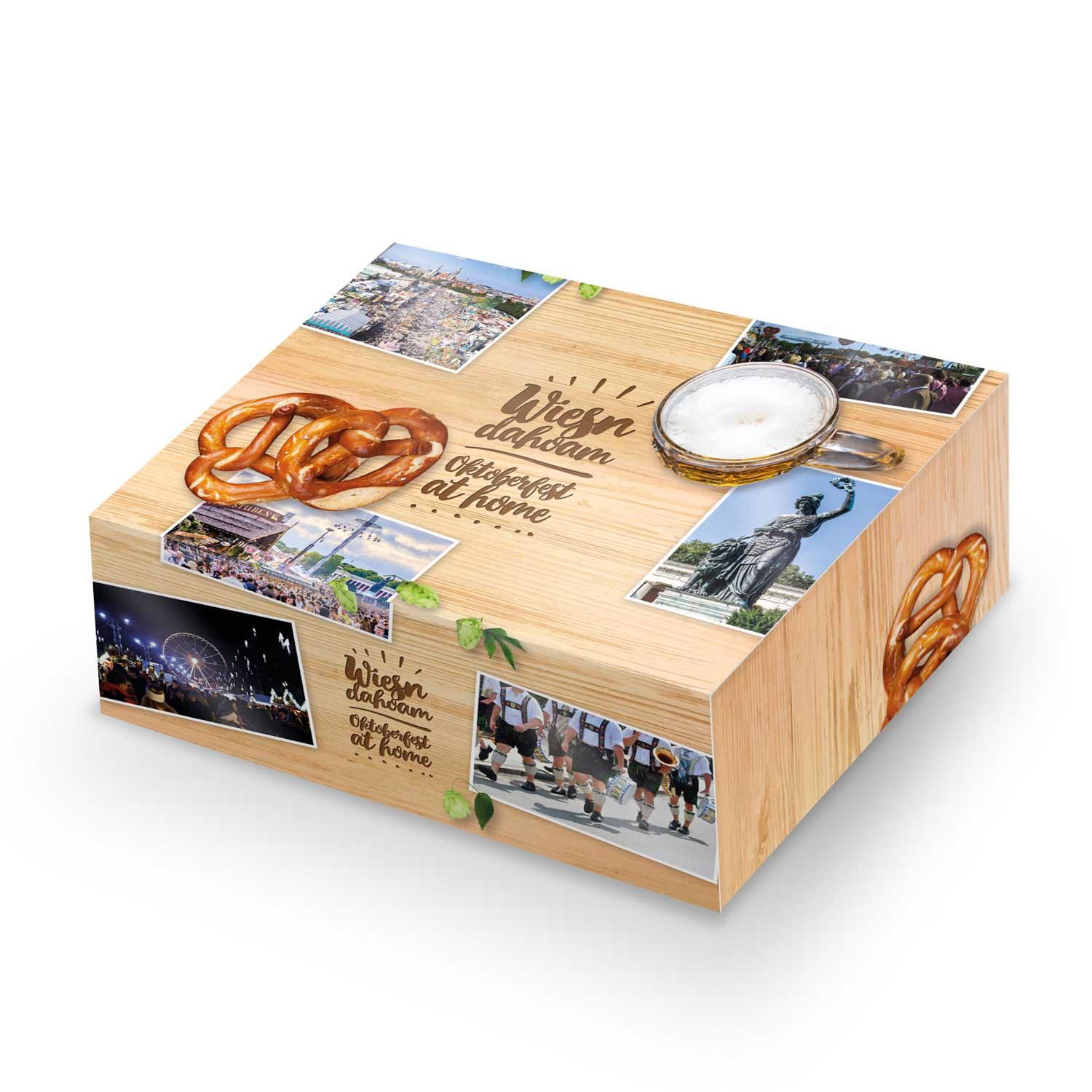 Oktoberfest-Box mit Bierflasche, Lebkuchenherz mit Schriftzug „Oktoberfest“ und rustikalem Brotzeitbrett.