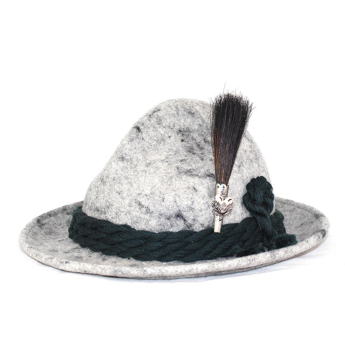 Originaler Gamsbart aus dunklem Antilopenhaar mit heller Spitze und Grandl-Hirschzahnimitation, ca. 10 cm hoch.