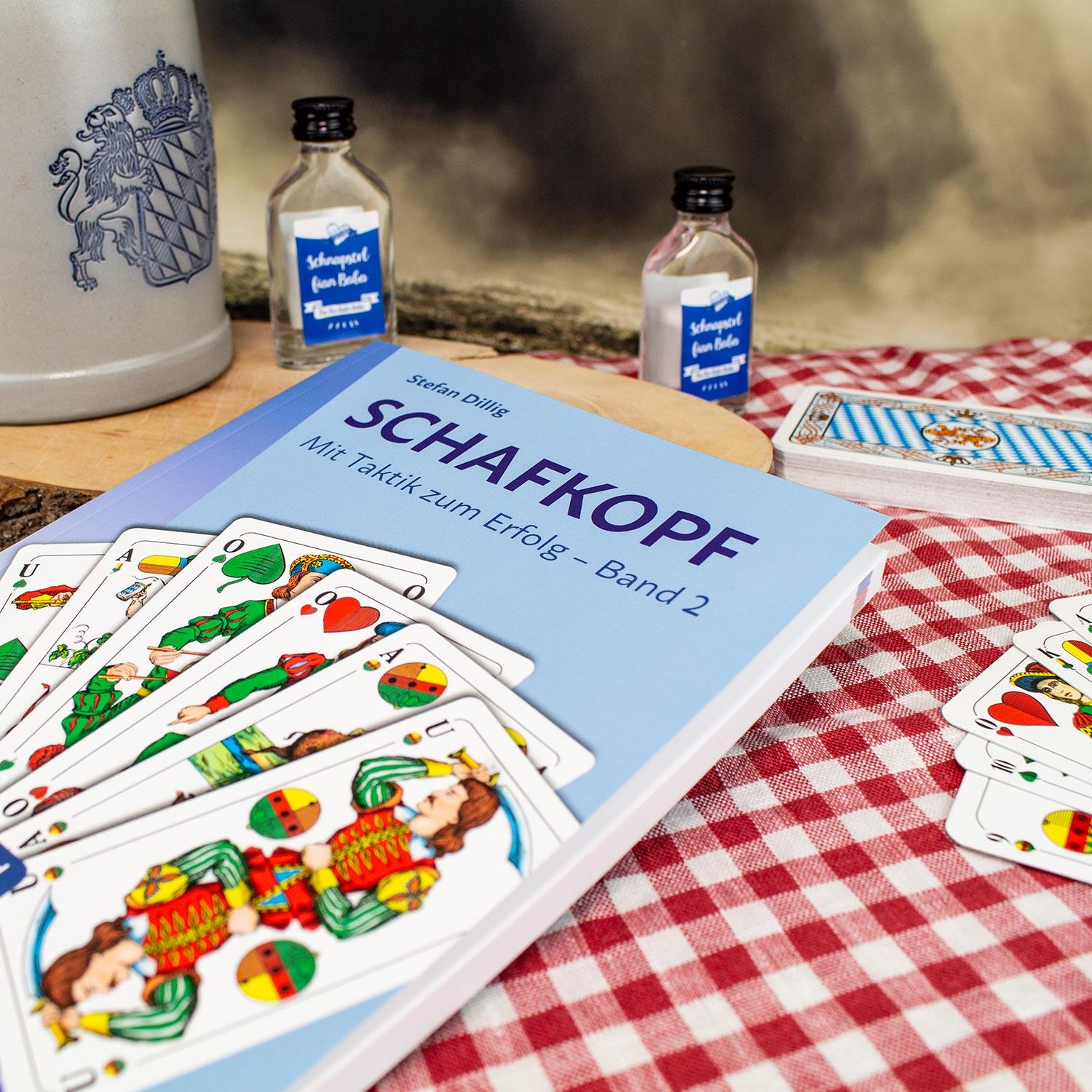 Buch „Schafkopf: Mit Taktik zum Erfolg – Band 2“ mit farbigem Cover und Kartenmotiv, für Lernende bis Turnierspieler.