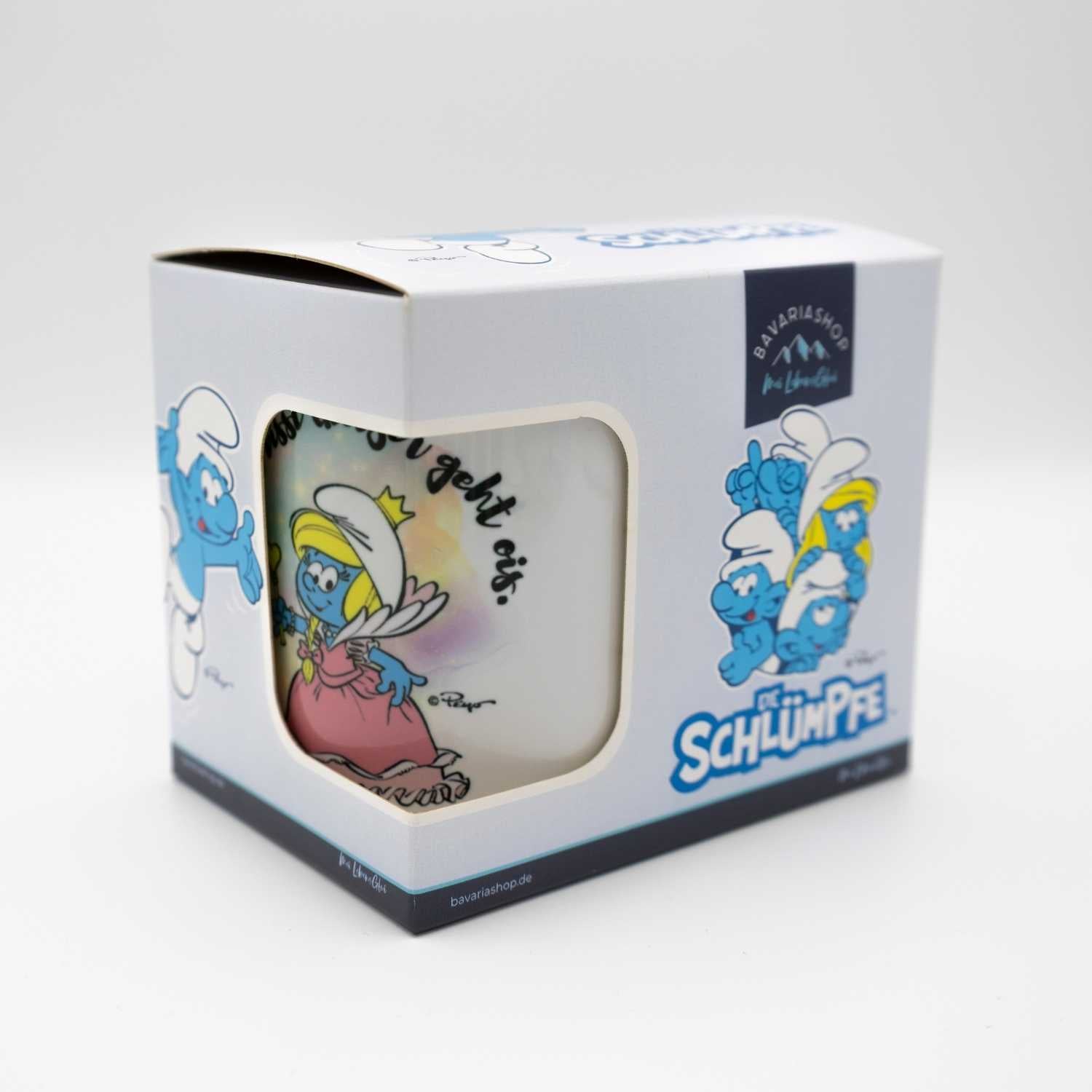 Die Schlümpfe Emailletasse "Glitzer" im Karton, mit Schlumpfine auf der Tasse und weiteren Schlümpfen außen.