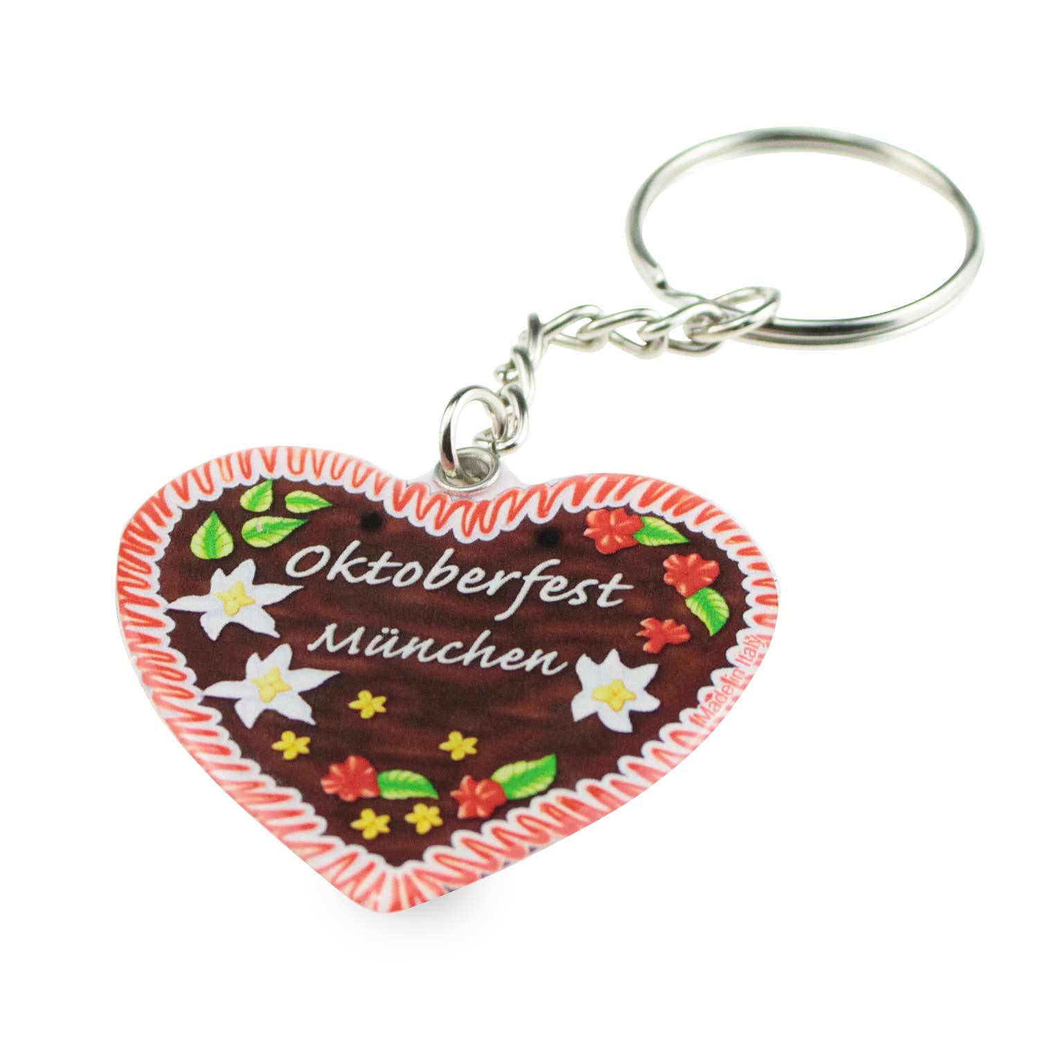 Herzförmiger Schlüsselanhänger in Lebkuchenoptik mit weißer Zuckerschrift und blau-weißem Rand, ca. 5×4 cm.