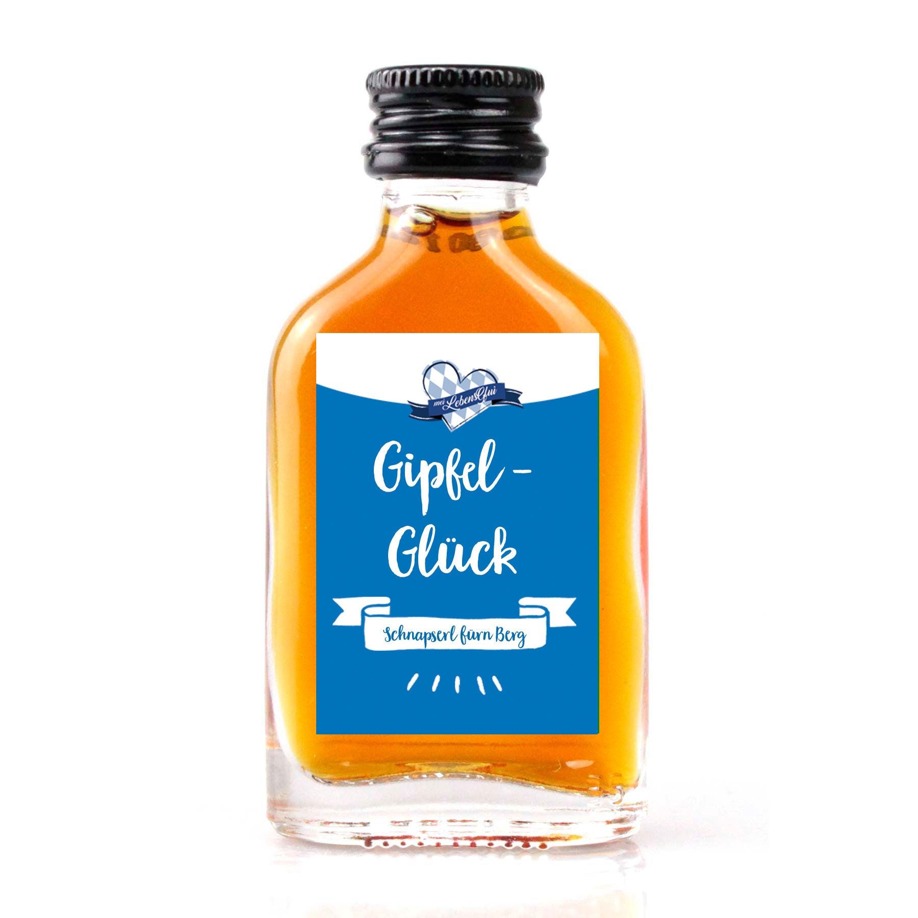 Kleines Schnapserl mit Kräuterlikör, 20 ml, 30 % vol., mit Aufdruck „Gipfel-Glück“ und Bergmotiv auf transparentem Etikett.