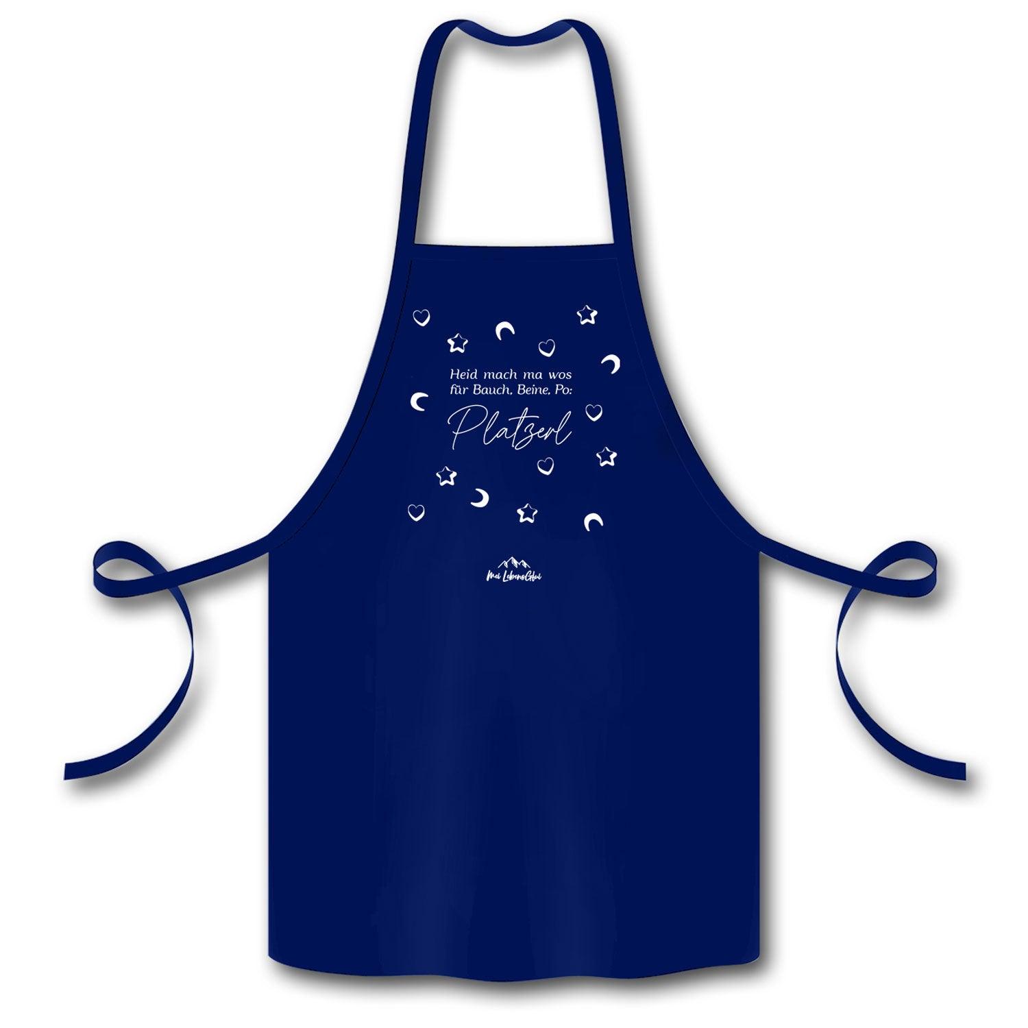 Küchenschürze mit mittigem Schriftzug „Heid mach ma wos für Bauch, Beine, Po: Platzerl“, aus Bio-Baumwolle.