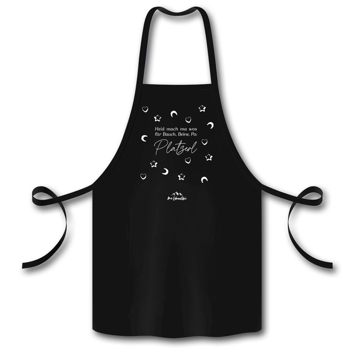 Küchenschürze mit eingesäumtem Schriftzug „Heid mach ma wos für Bauch, Beine, Po: Platzerl“, aus Bio-Baumwolle.
