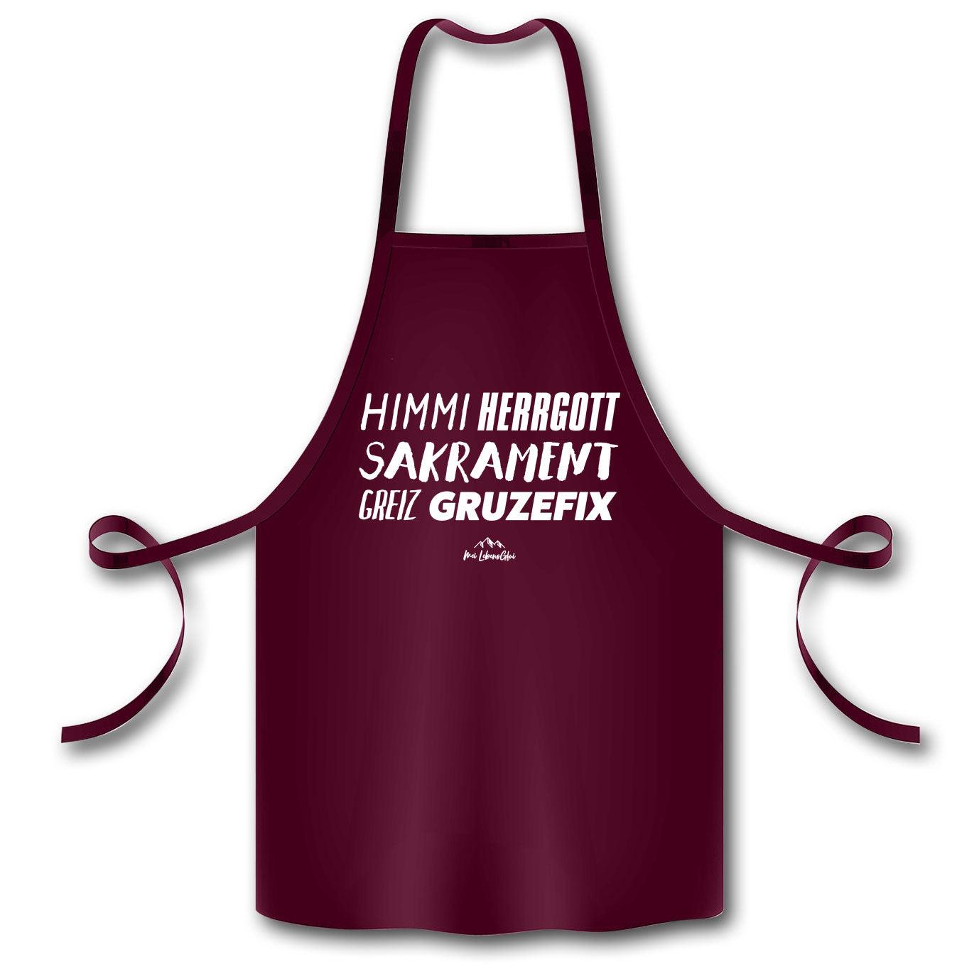 Küchenschürze mit aufgedrucktem Schriftzug „Himmiherrgottsakrament…“, glatte Oberfläche, 100 % Bio-Baumwolle, 60 × 87 cm.