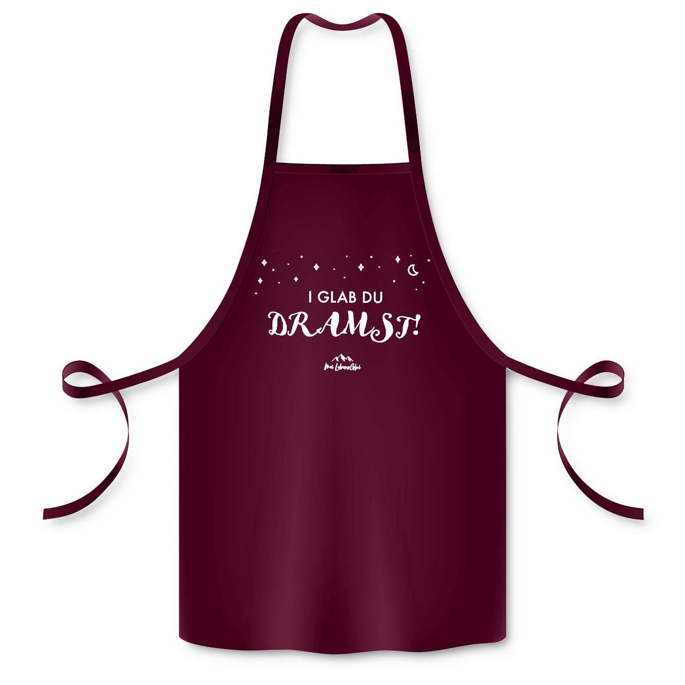 Küchenschürze aus Baumwolle mit mittig platziertem Schriftzug „I glab du dramst!“ in weißer Schrift.