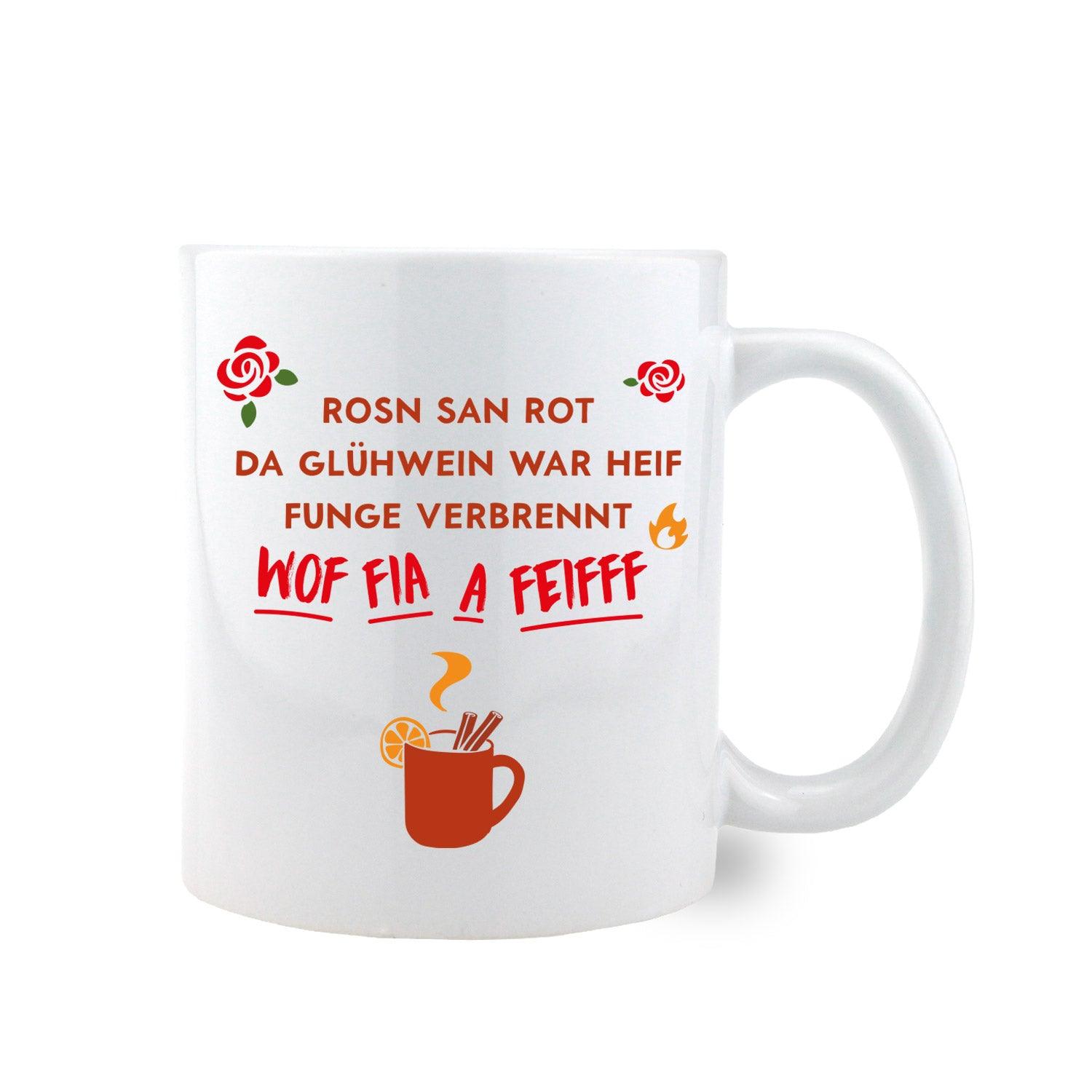 Keramiktasse mit bauchiger Form, bayerischem Schriftzug „Glühwein war heif...“ und Herzmotiv, ca. 330 ml.