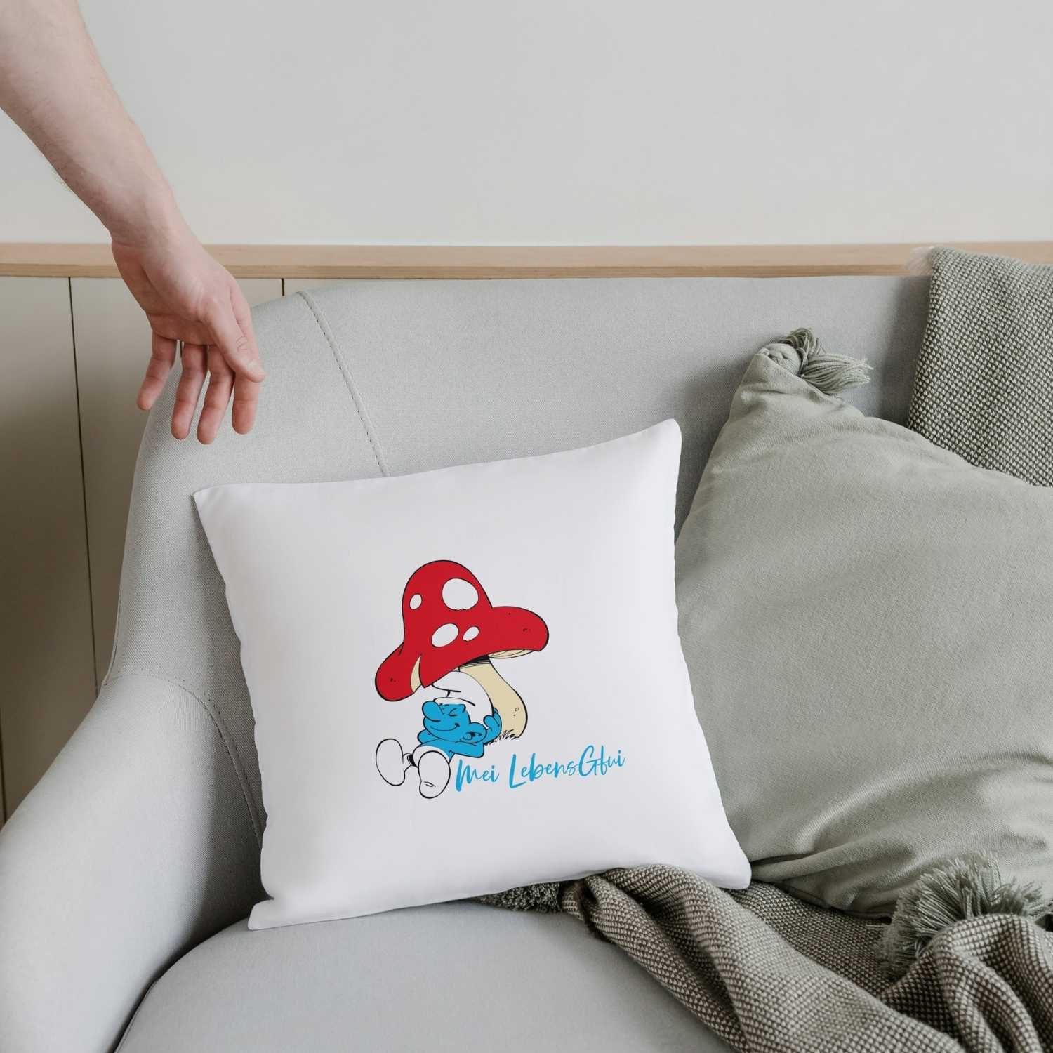 Quadratisches Kuschelkissen mit Schlumpf-Motiv und dem Schriftzug „Do legst di nieda!“, weich und hochwertig bedruckt.